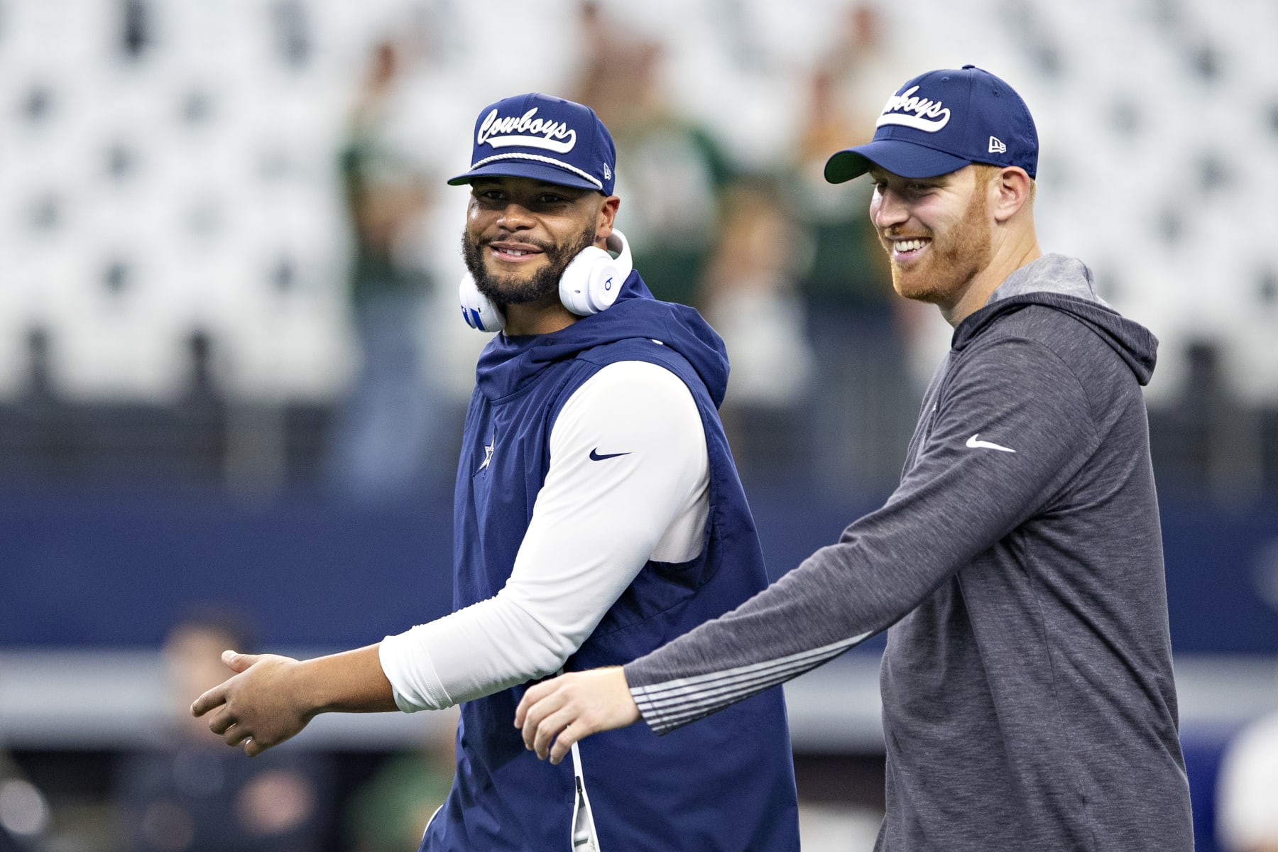 ARLINGTON, TX - OCTOBER 6:  Dak Prescott #4 and Cooper Rush #7 of the Dallas Cowboys warm up before a game against the Green Bay Packers at AT&T Stadium on October 6, 2019 in Arlington, Texas.  The Packers defeated the Cowboys 34-24.  (Photo by Wesley Hitt/Getty Images)