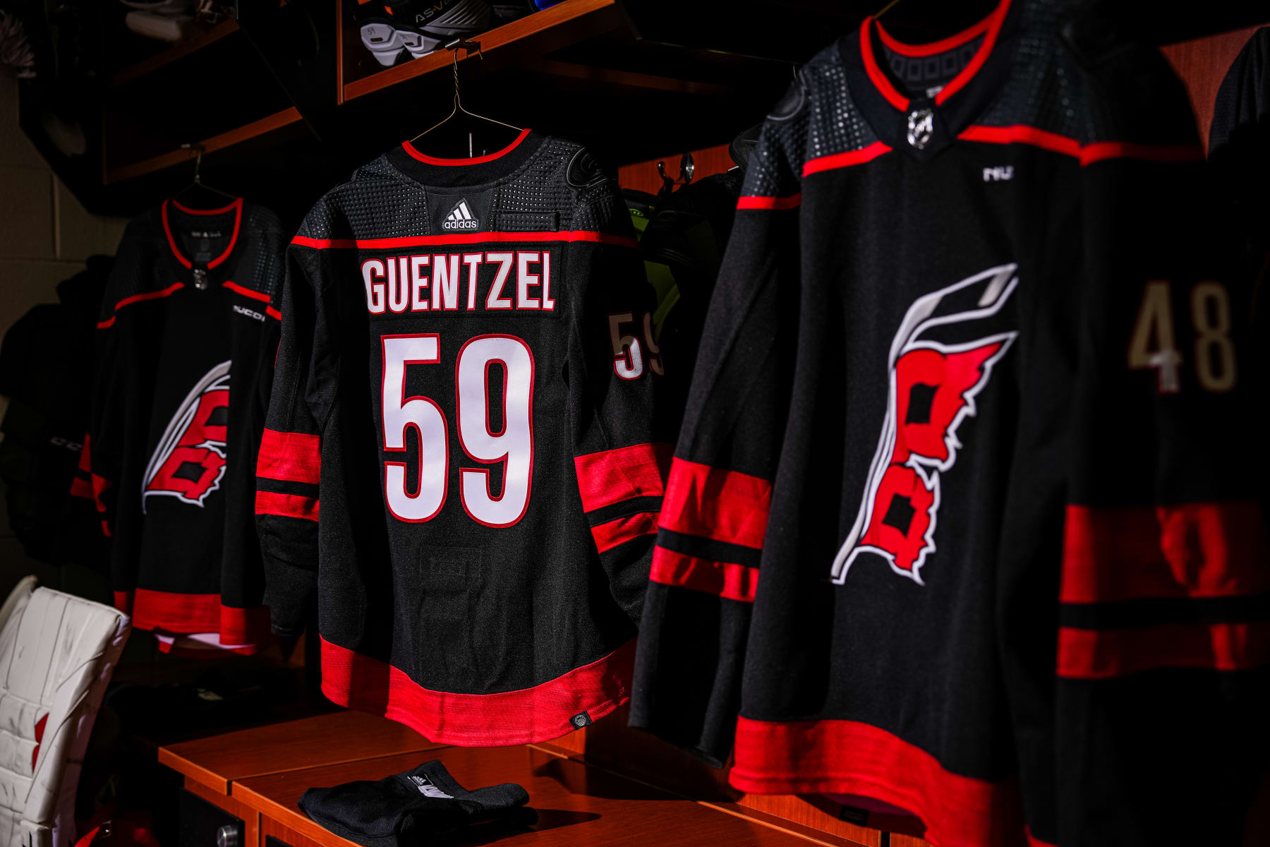 RALEIGH, NORTH CAROLINA - MARCH 12:  The sweater of Jake Guentzel #59 of the Carolina Hurricanes is seen hanging in the locker room prior to a game against the New York Rangers at PNC Arena on March 12, 2024 in Raleigh, North Carolina. (Photo by Josh Lavallee/NHLI via Getty Images)
