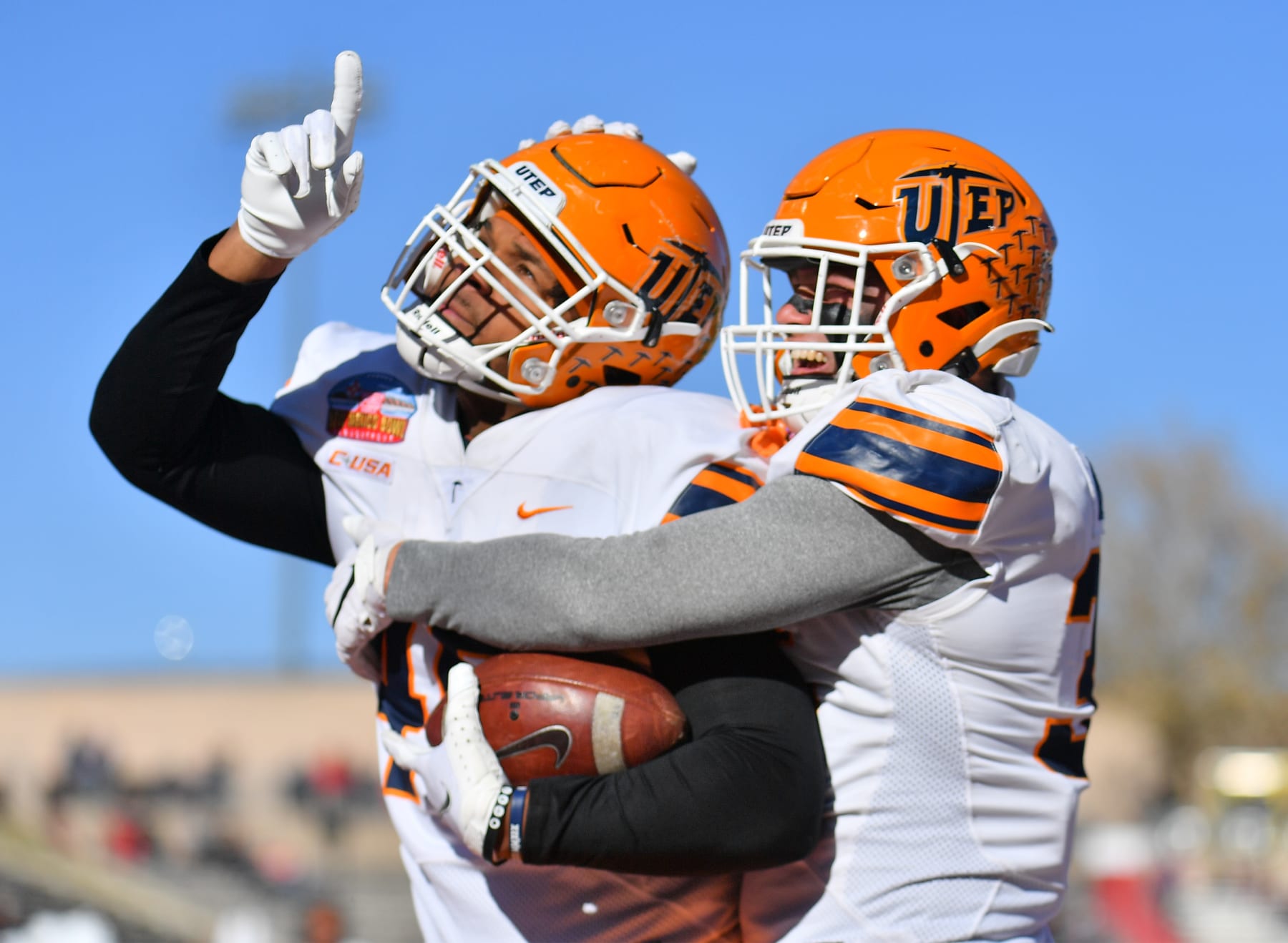 ALBUQUERQUE, NEW MEXICO - DECEMBER 18:  Tight end Trent Thompson #45 and fullback Forest McKee #35 of the UTEP Miners celebrate after Thompson caught a pass for a touchdown against the Fresno State Bulldogs during the PUBG Mobile New Mexico Bowl at University Stadium on December 18, 2021 in Albuquerque, New Mexico.  (Photo by Sam Wasson/Getty Images)