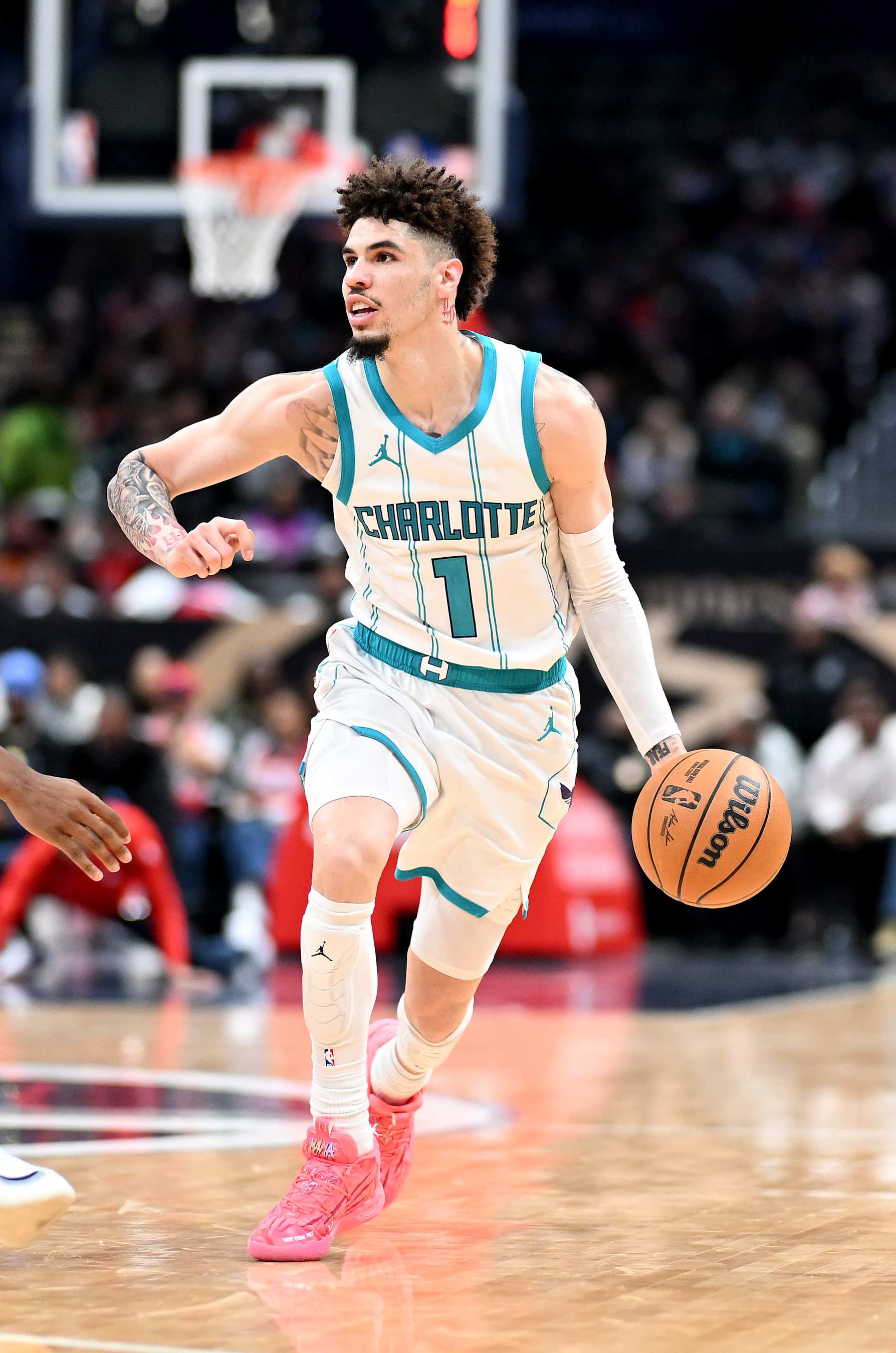 WASHINGTON, DC - DECEMBER 26: LaMelo Ball #1 of the Charlotte Hornets handles the ball against the Washington Wizards at Capital One Arena on December 26, 2024 in Washington, DC. NOTE TO USER: User expressly acknowledges and agrees that, by downloading and or using this photograph, User is consenting to the terms and conditions of the Getty Images License Agreement.  (Photo by G Fiume/Getty Images)