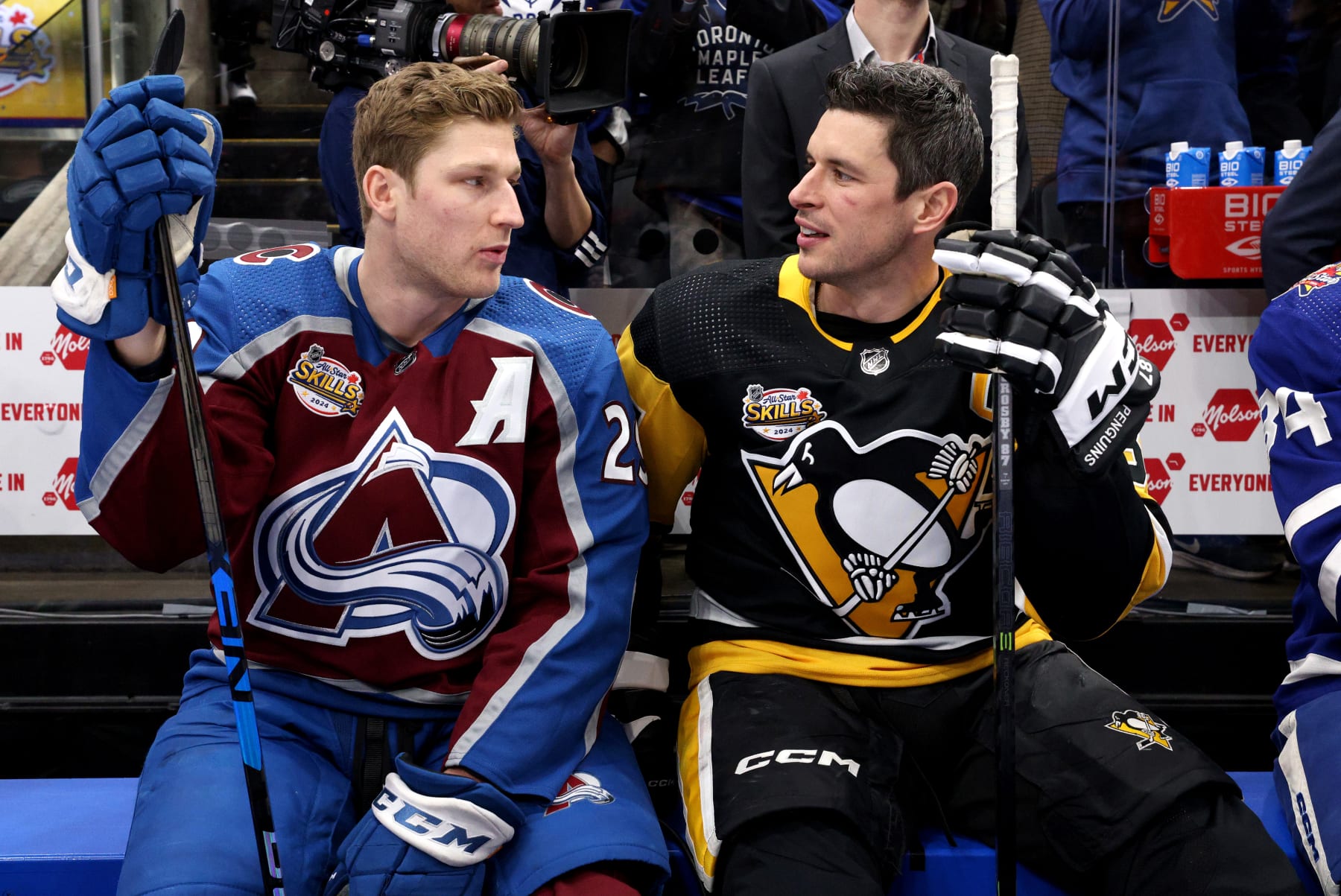 TORONTO, ONTARIO - FEBRUARY 02: Sidney Crosby #87 of the Pittsburgh Penguins (R) and Nathan MacKinnon #29 of the Colorado Avalanche look on during the 2024 NHL All-Star Skills Competition at Scotiabank Arena on February 02, 2024 in Toronto, Ontario, Canada. (Photo by Dave Sandford/NHLI via Getty Images)