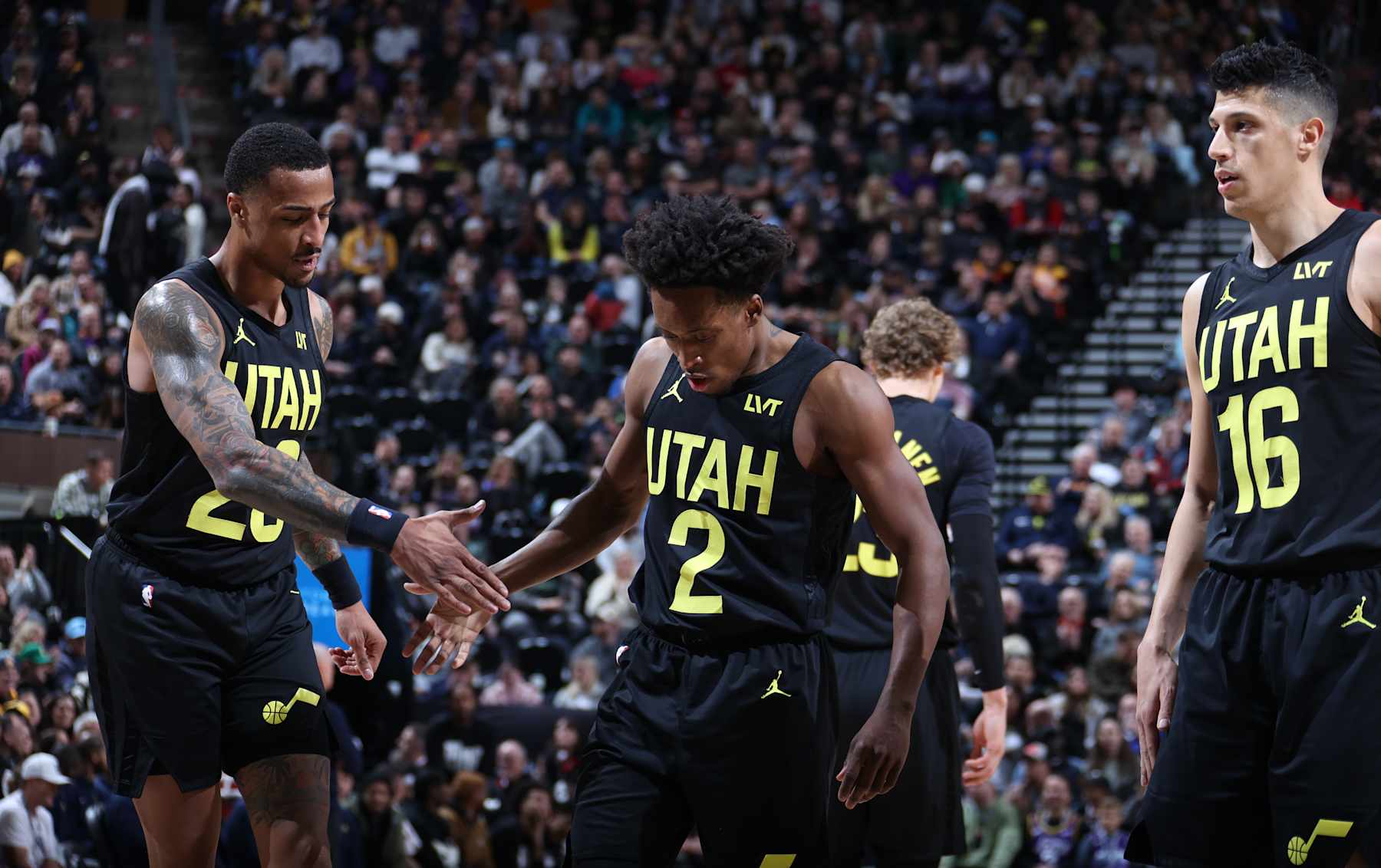 SALT LAKE CITY, UT - JANUARY 15: Colin Sexton #2 high-fives John Collins #20 of the Utah Jazz during the game against the Indiana Pacers on January 15, 2024 at Delta Center in Salt Lake City, Utah. NOTE TO USER: User expressly acknowledges and agrees that, by downloading and or using this Photograph, User is consenting to the terms and conditions of the Getty Images License Agreement. Mandatory Copyright Notice: Copyright 2024 NBAE (Photo by Melissa Majchrzak/NBAE via Getty Images)