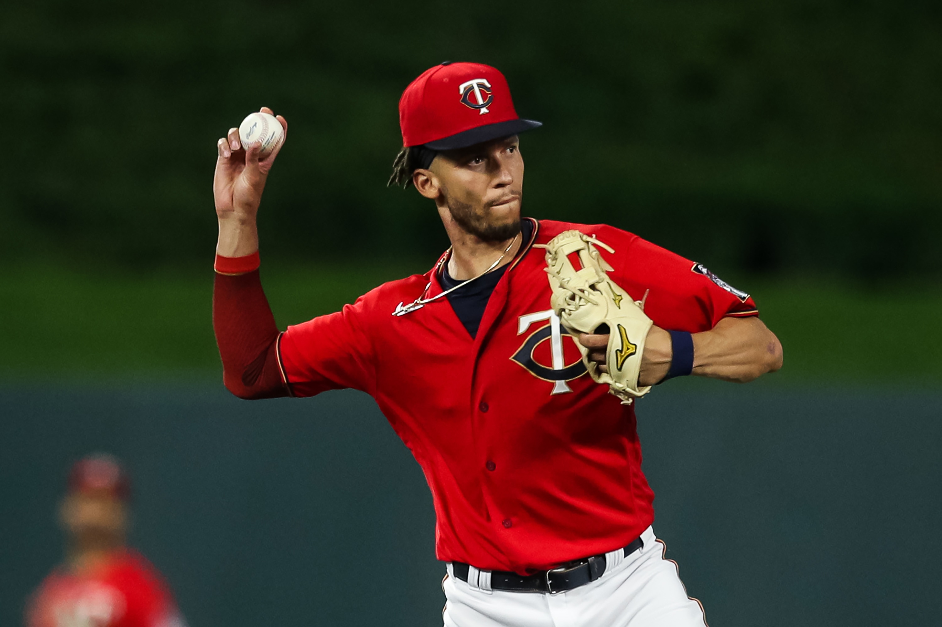 MINNEAPOLIS, MINNESOTA - AUGUST 31: Andrelton Simmons #9 of the Minnesota Twins throws the ball to first base to get out Frank Schwindel of the Chicago Cubs in the third inning of the game at Target Field on August 31, 2021 in Minneapolis, Minnesota. The Cubs defeated the Twins 3-1. (Photo by David Berding/Getty Images)