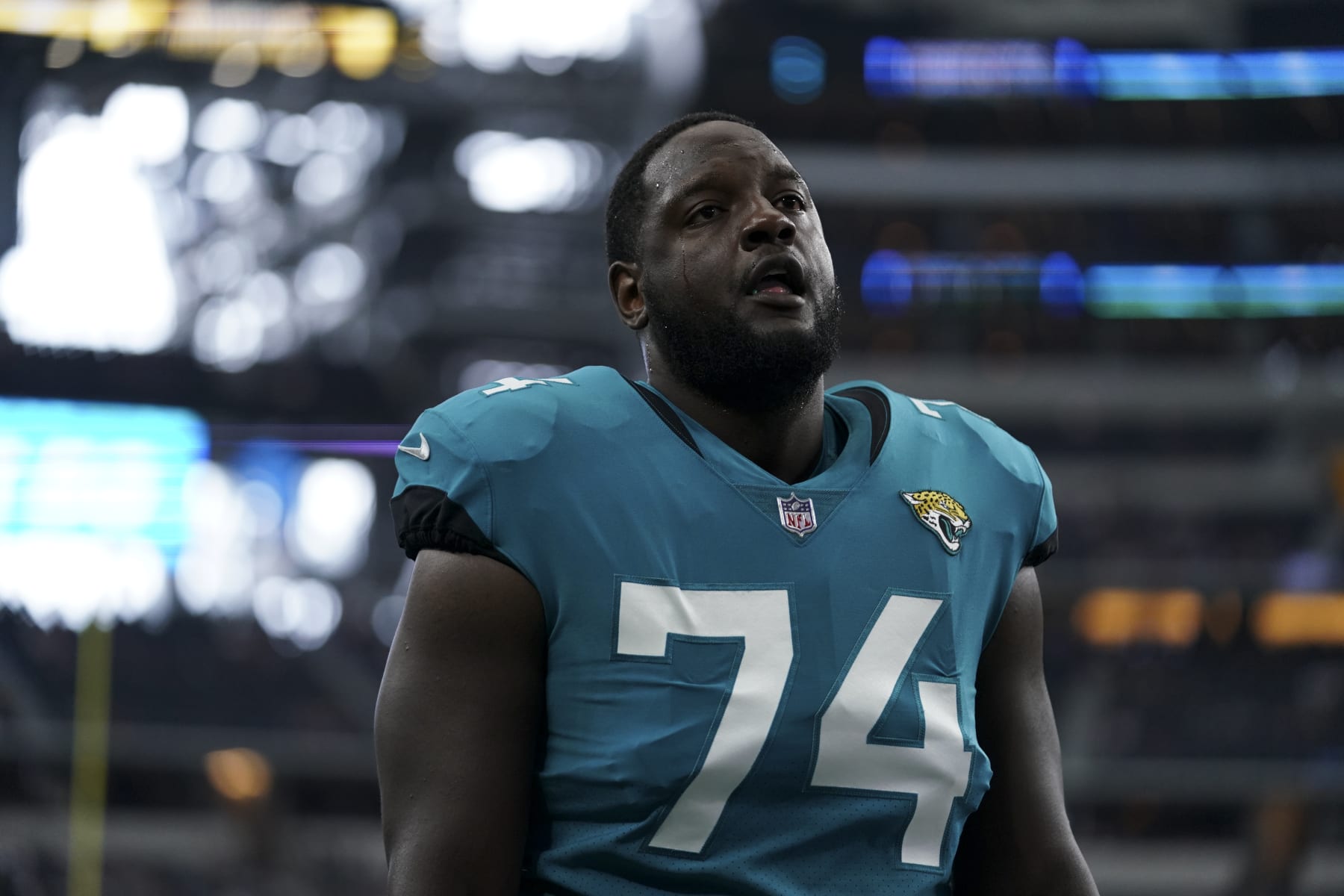 ARLINGTON, TEXAS - AUGUST 29: Cam Robinson #74 of the Jacksonville Jaguars walks off of the field during an NFL game against the Dallas Cowboys at AT&T Stadium on August 29, 2021 in Arlington, Texas. (Photo by Cooper Neill/Getty Images)