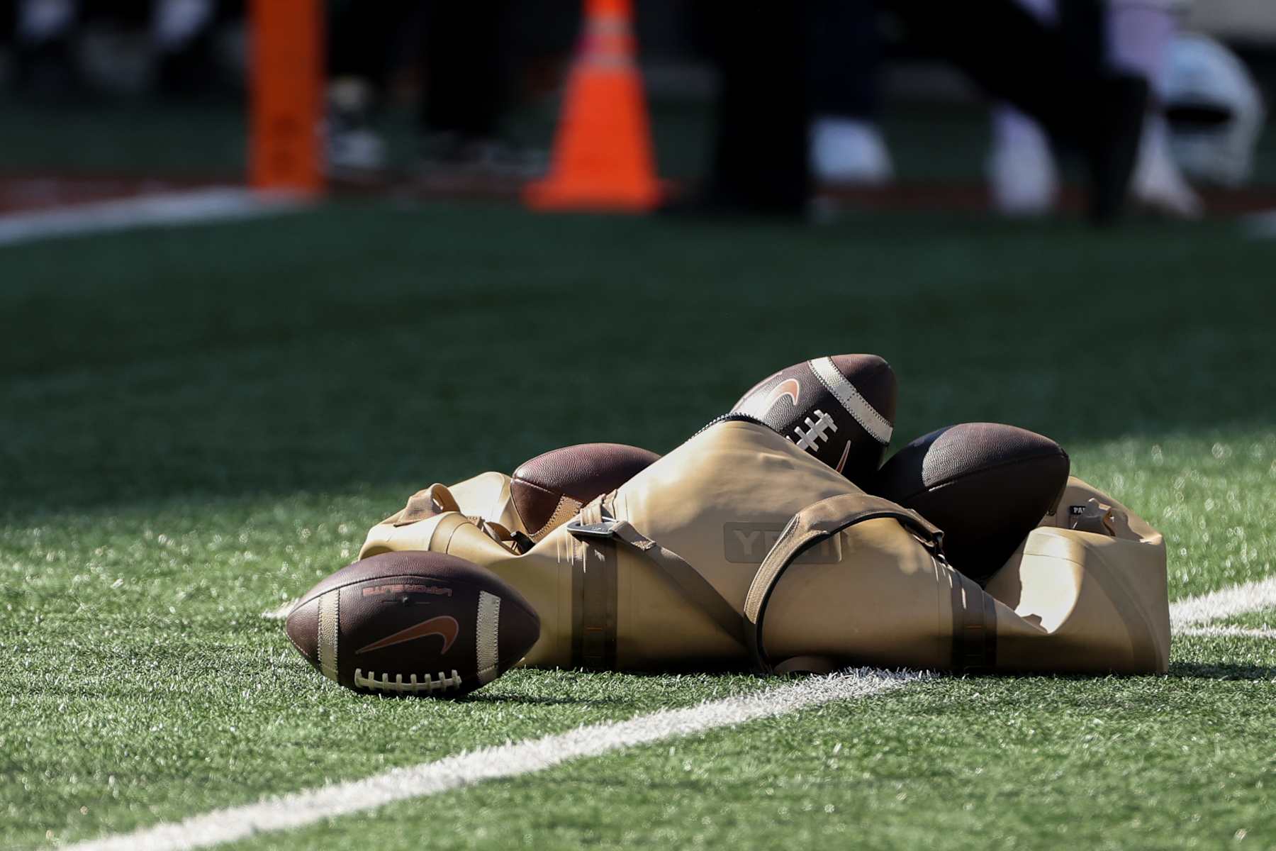 AUSTIN, TX - NOVEMBER 23: A Yeti bag of Texas logo footballs sits on the field before the SEC college football game between Texas Longhorns and Kentucky Wildcats on November 23, 2024, at Darrell K Royal - Texas Memorial Stadium in Austin, TX. (Photo by David Buono/Icon Sportswire via Getty Images)