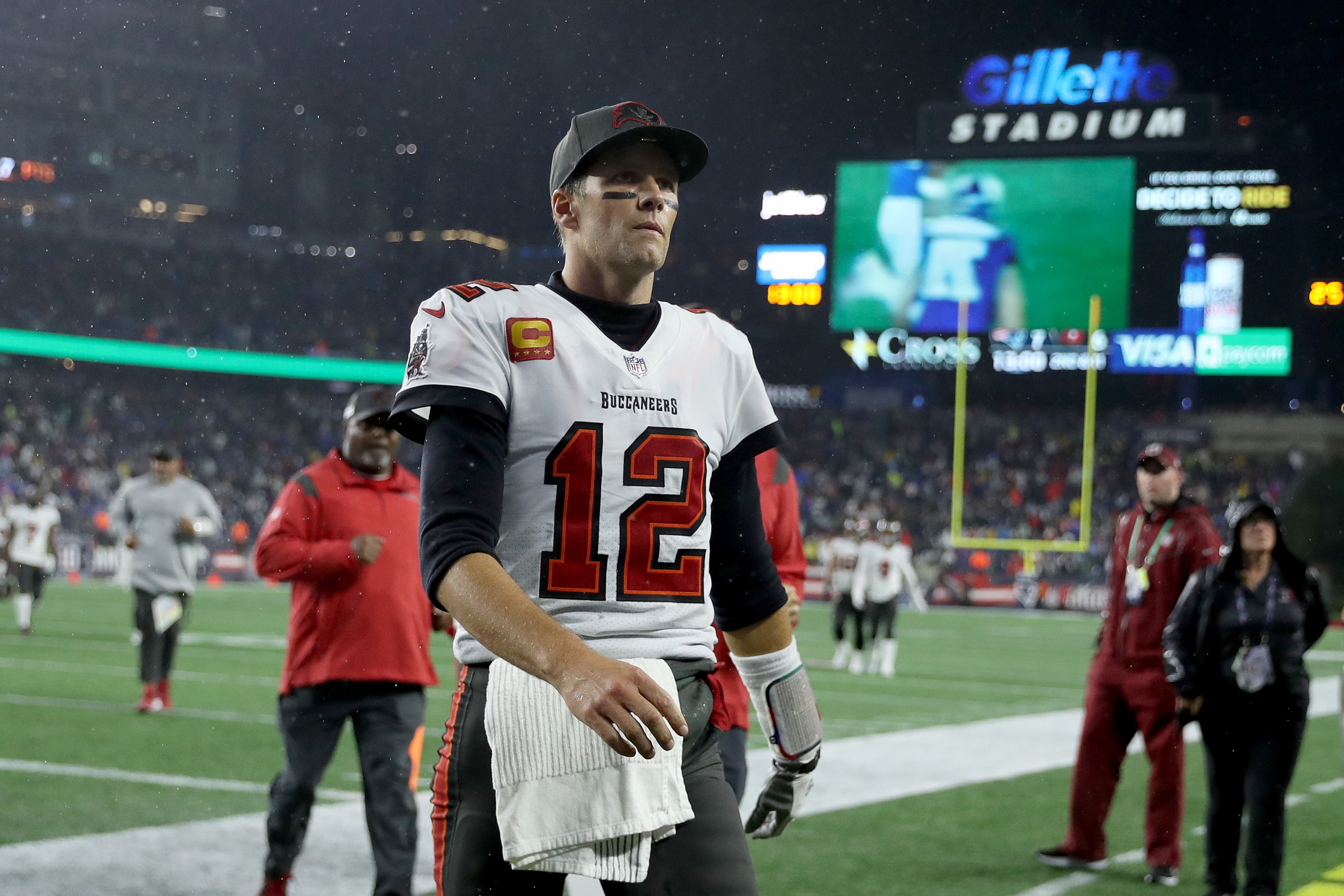 FOXBOROUGH, MASSACHUSETTS - OCTOBER 03: Tom Brady #12 of the Tampa Bay Buccaneers walks off the field after the second quarter in the game against the New England Patriots at Gillette Stadium on October 03, 2021 in Foxborough, Massachusetts. (Photo by Maddie Meyer/Getty Images)