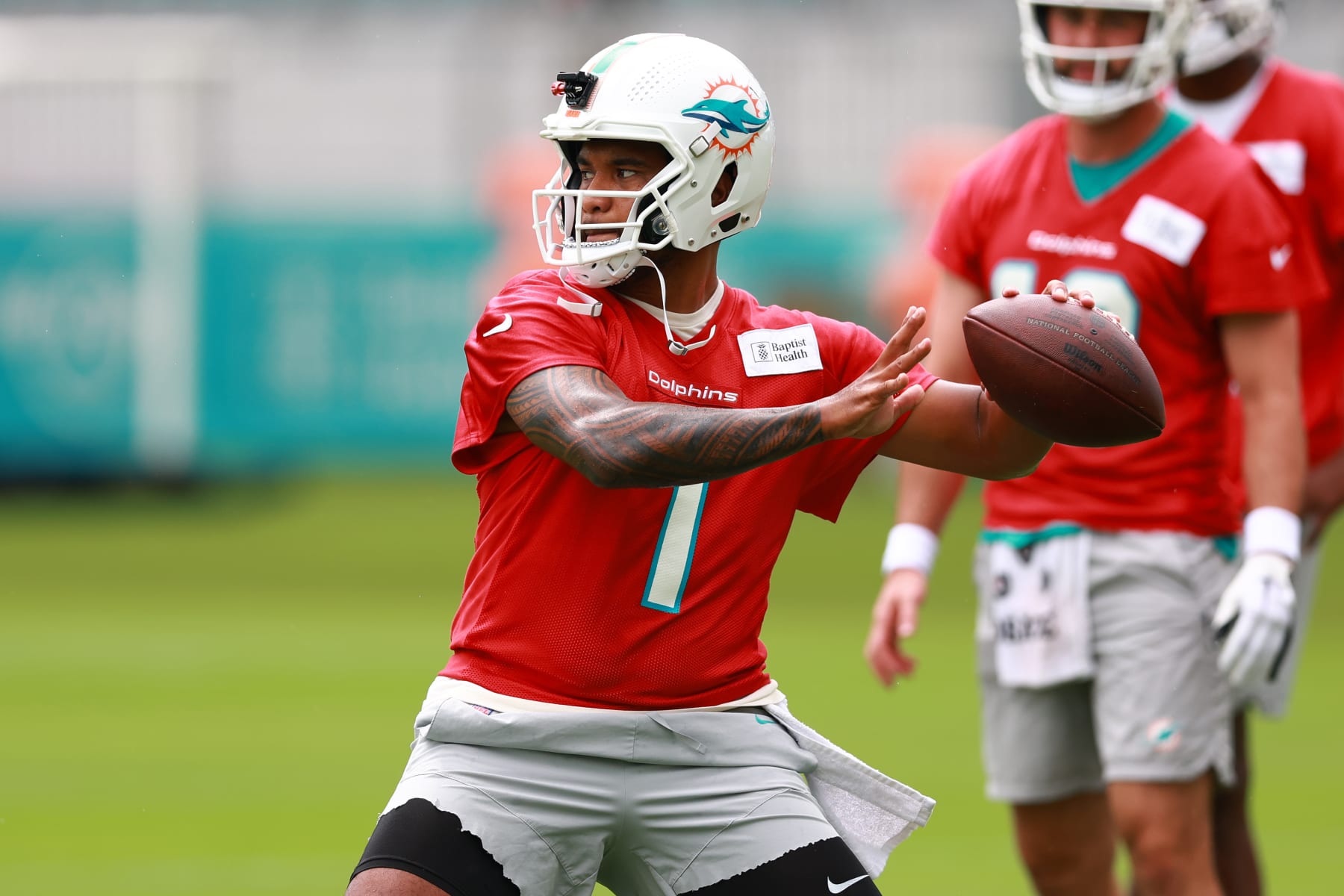 MIAMI GARDENS, FLORIDA - JULY 26: Tua Tagovailoa #1 of the Miami Dolphins takes part in a drill during training camp at Baptist Health Training Complex on July 26, 2023 in Miami Gardens, Florida. (Photo by Megan Briggs/Getty Images)
