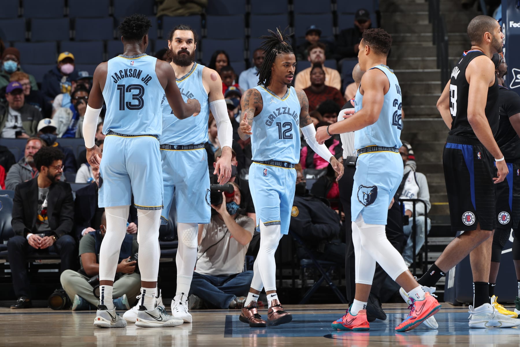 MEMPHIS, TN - FEBRUARY 8: Ja Morant #12 of the Memphis Grizzlies high fives Desmond Bane #22 of the Memphis Grizzlies during the game against the Los Angeles Clippers on February 8, 2022 at FedExForum in Memphis, Tennessee. NOTE TO USER: User expressly acknowledges and agrees that, by downloading and or using this photograph, User is consenting to the terms and conditions of the Getty Images License Agreement. Mandatory Copyright Notice: Copyright 2022 NBAE (Photo by Joe Murphy/NBAE via Getty Images)