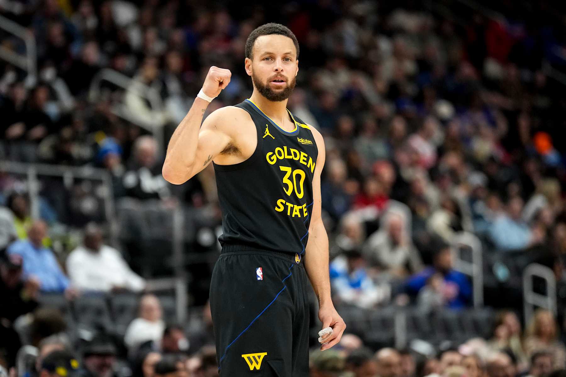 DETROIT, MICHIGAN - JANUARY 09: Stephen Curry #30 of the Golden State Warriors looks on and raises a fist during the game against the Detroit Pistons at Little Caesars Arena on January 09, 2025 in Detroit, Michigan. NOTE TO USER: User expressly acknowledges and agrees that, by downloading and or using this photograph, User is consenting to the terms and conditions of the Getty Images License Agreement. (Photo by Nic Antaya/Getty Images)