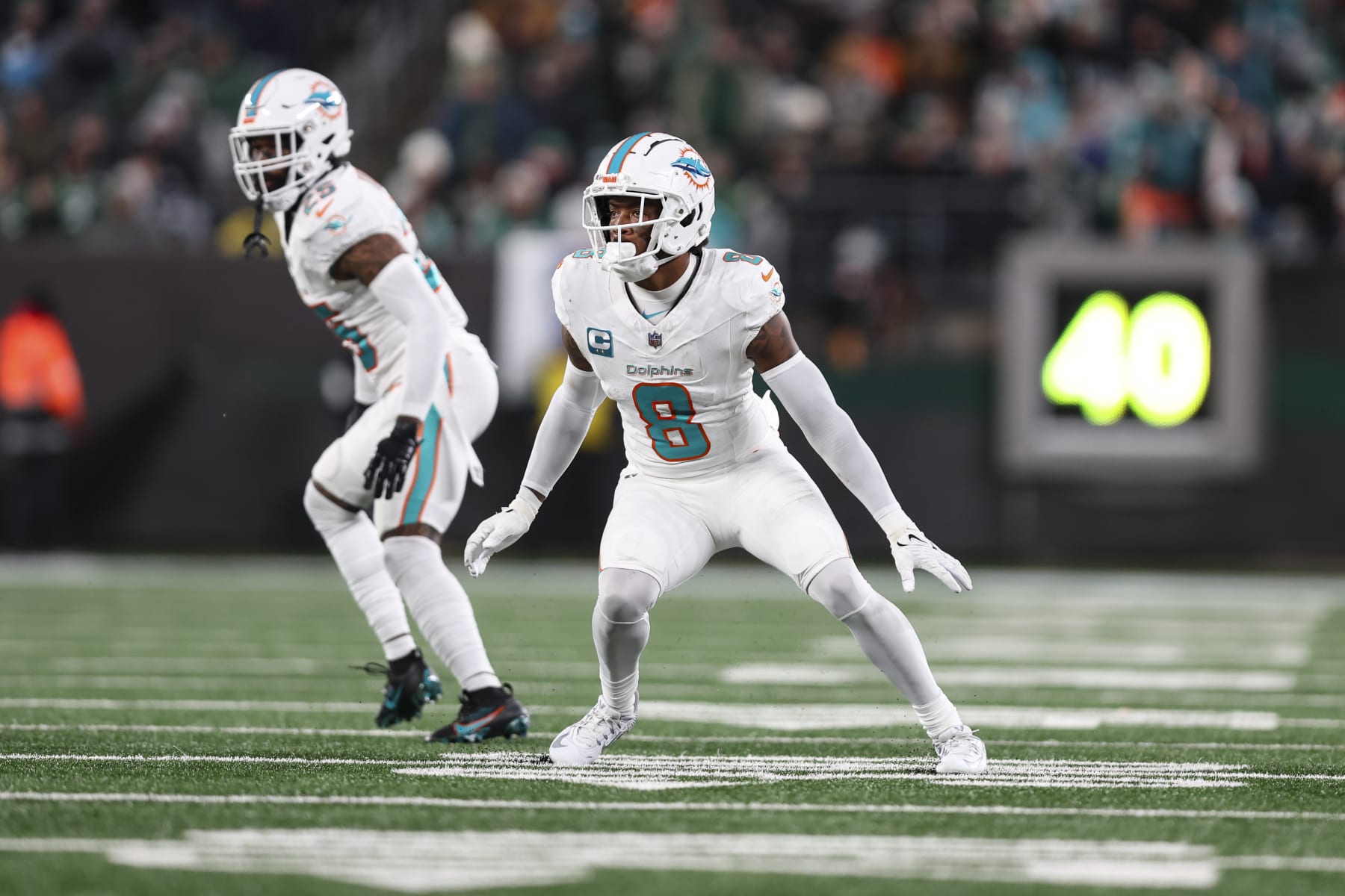 EAST RUTHERFORD, NJ - NOVEMBER 24: Jevon Holland #8 of the Miami Dolphins defends in coverage during an NFL football game against the New York Jets at MetLife Stadium on November 24, 2023 in East Rutherford, New Jersey. (Photo by Perry Knotts/Getty Images)