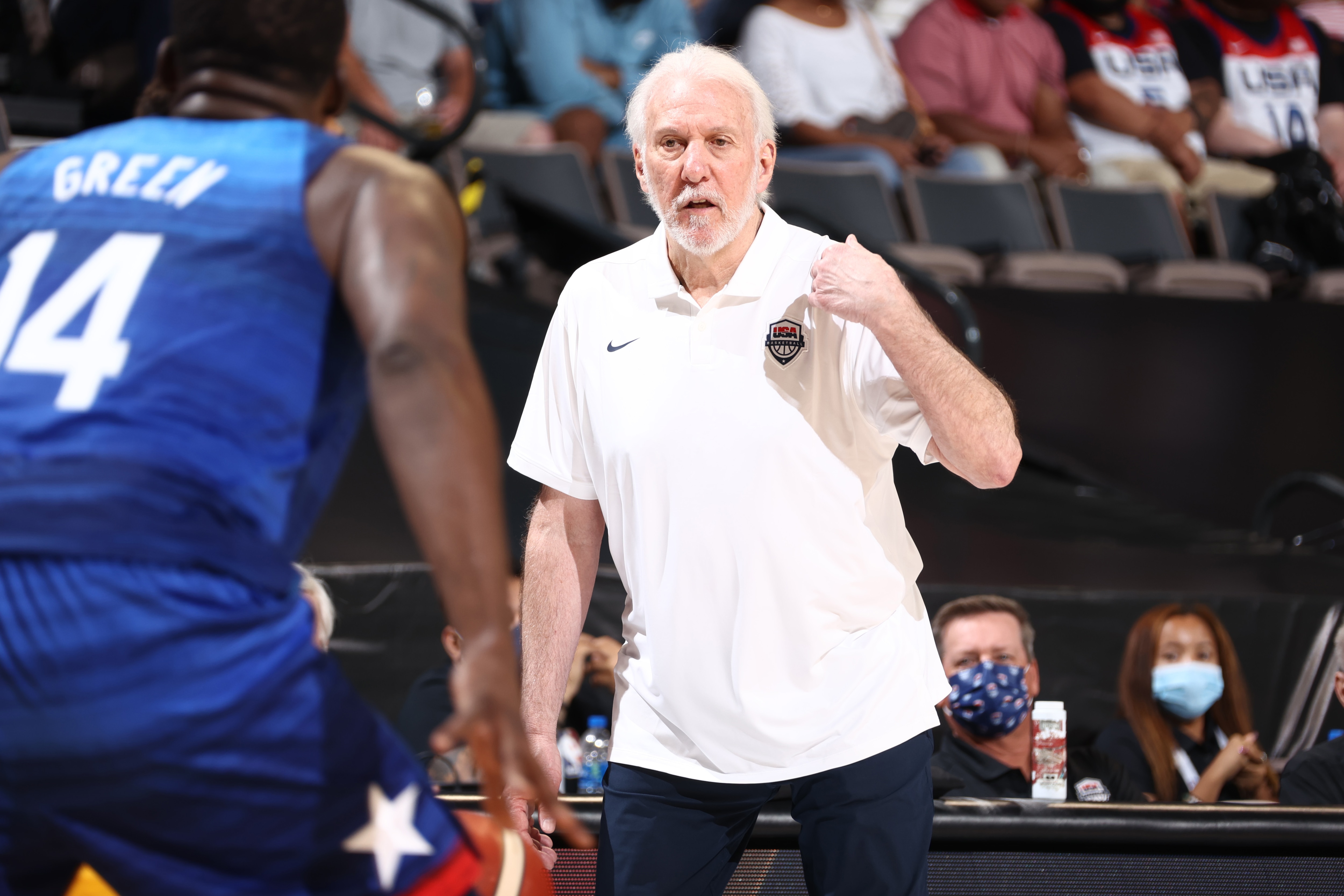 LAS VEGAS, NV - JULY 12: Head Coach Gregg Popovich of the USA Men's National Team talks with Draymond Green #14 during the game against the Australia Men's National Team on July 12, 2021 at Michelob ULTRA Arena in Las Vegas, Nevada. NOTE TO USER: User expressly acknowledges and agrees that, by downloading and or using this photograph, User is consenting to the terms and conditions of the Getty Images License Agreement. (Photo by Ned Dishman/NBAE via Getty Images)