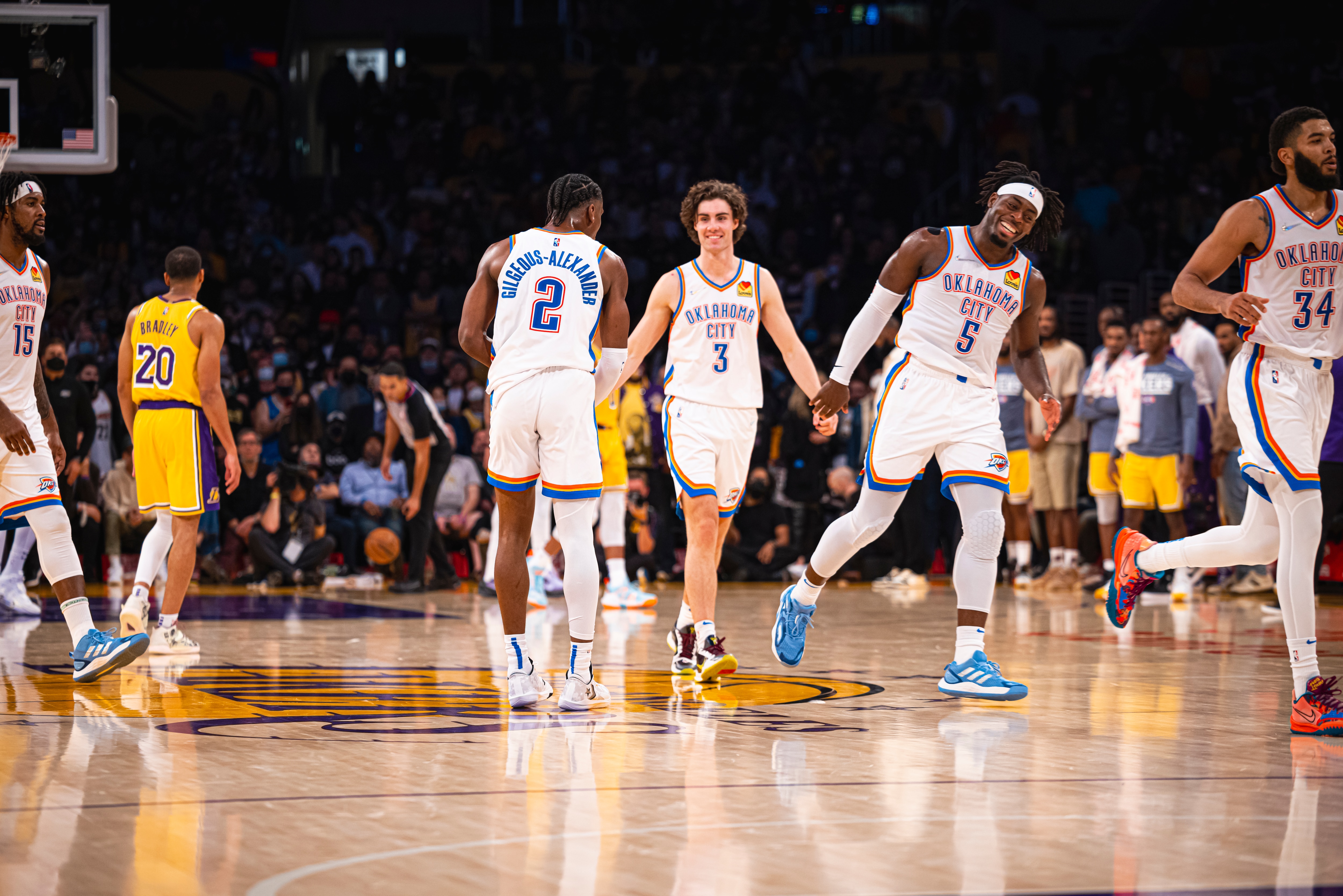 LOS ANGELES, CA - NOVEMBER 4: Shai Gilgeous-Alexander #2, Josh Giddey #3 and Luguentz Dort #5 of the Oklahoma City Thunder smile and run up court against the Los Angeles Lakers on November 4, 2021 at STAPLES Center in Los Angeles, California. NOTE TO USER: User expressly acknowledges and agrees that, by downloading and/or using this Photograph, user is consenting to the terms and conditions of the Getty Images License Agreement. Mandatory Copyright Notice: Copyright 2021 NBAE (Photo by Zach Beeker/NBAE via Getty Images)