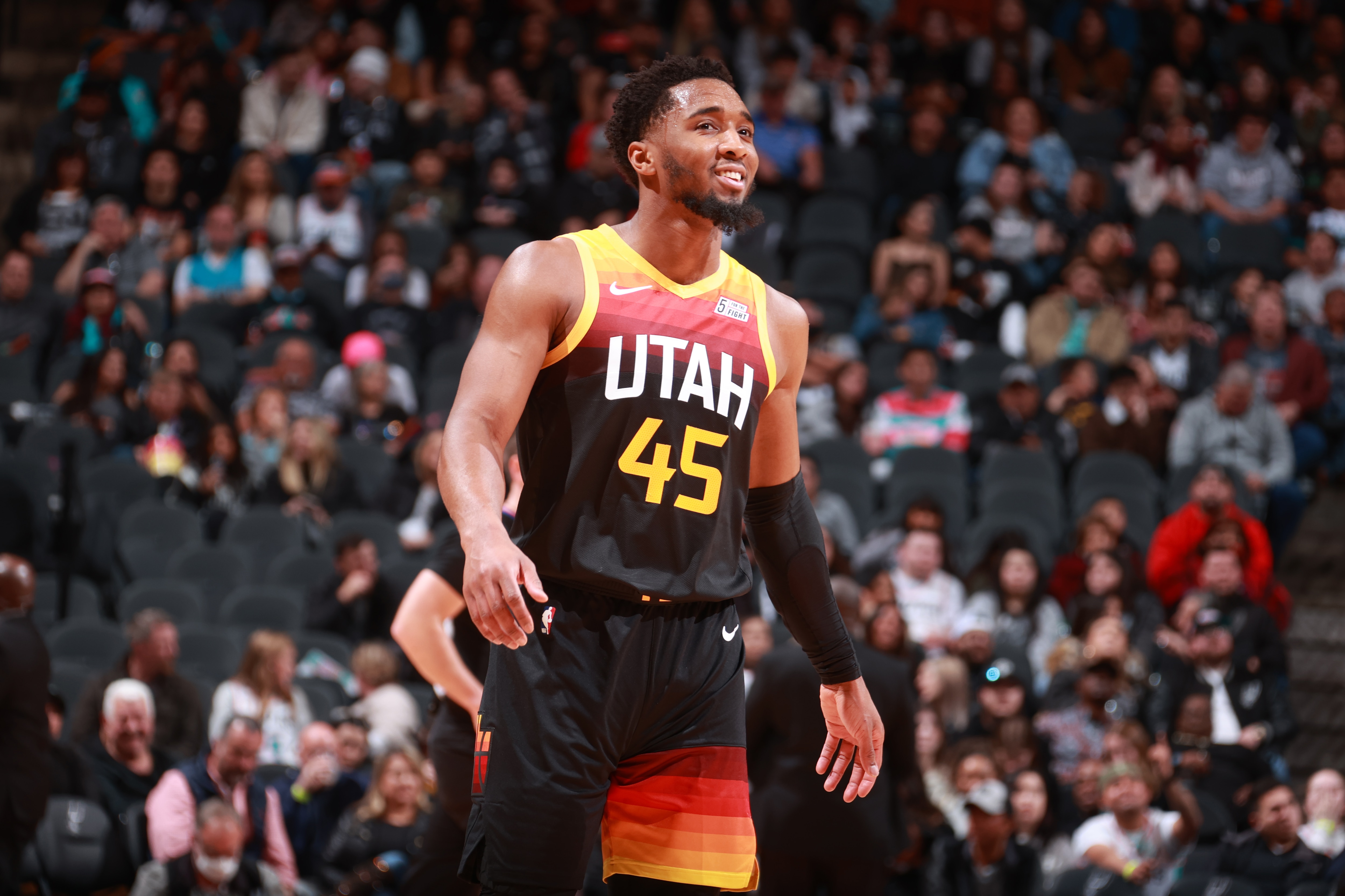SAN ANTONIO, TX - MARCH 11: Donovan Mitchell #45 of the Utah Jazz smiles during the game against the San Antonio Spurs on March 11, 2022 at the AT&T Center in San Antonio, Texas. NOTE TO USER: User expressly acknowledges and agrees that, by downloading and or using this photograph, user is consenting to the terms and conditions of the Getty Images License Agreement. Mandatory Copyright Notice: Copyright 2022 NBAE (Photos by Nathaniel S. Butler/NBAE via Getty Images)