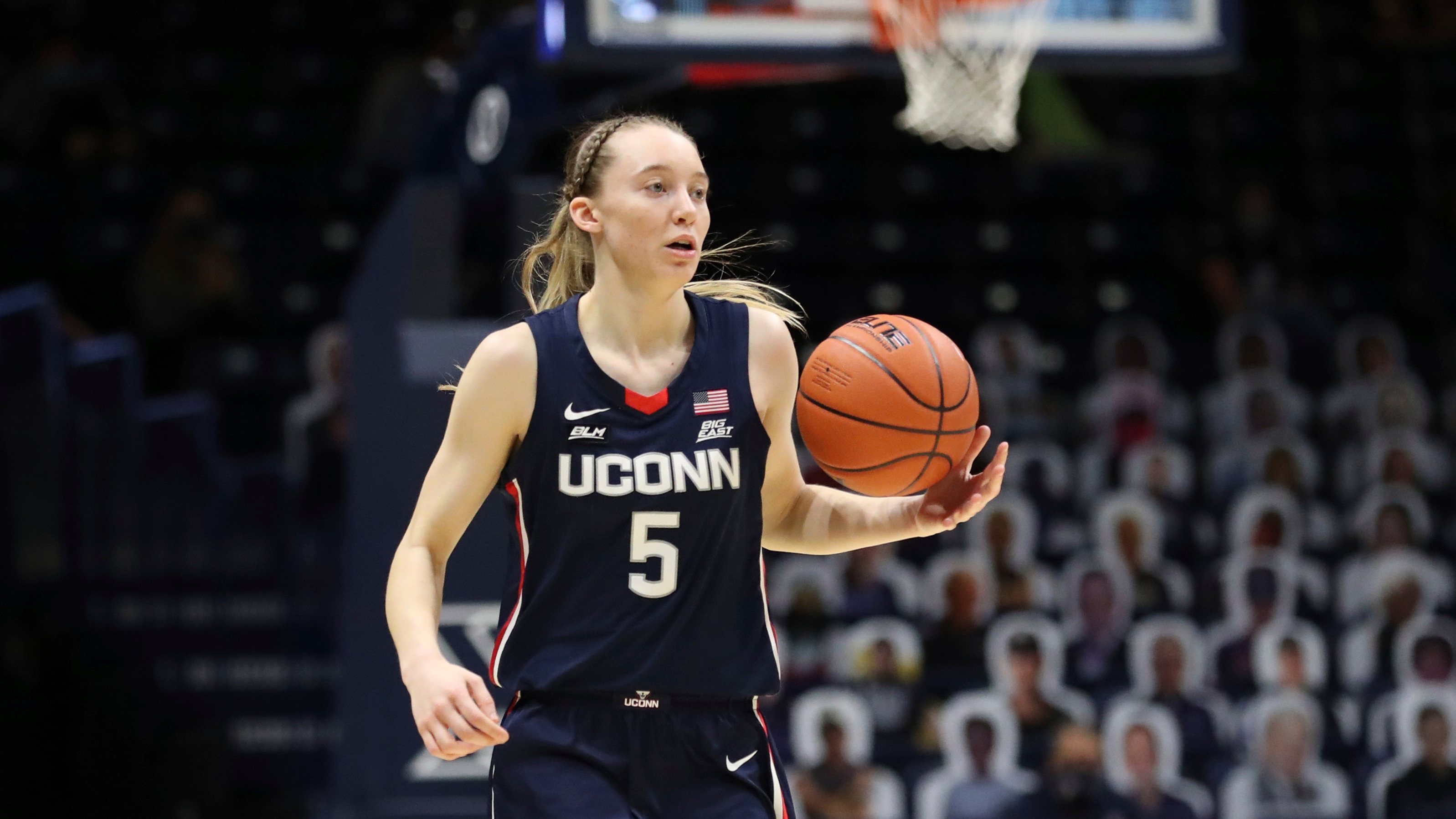UConn guard Paige Bueckers (5) moves up court against Xavier during the second half of an NCAA college basketball game Saturday, Feb. 20, 2021, in Cincinnati. UConn won 83-32. (AP Photo/Gary Landers)