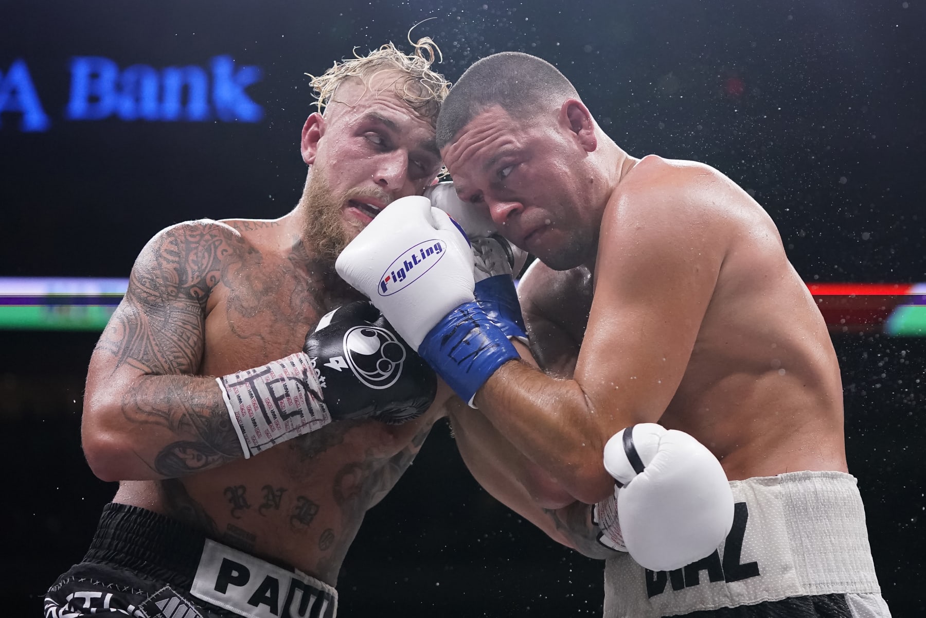 DALLAS, TEXAS - AUGUST 05: Jake Paul, left, and Nate Diaz, right, trade punches during the tenth round of their fight at the American Airlines Center on August 05, 2023 in Dallas, Texas. (Photo by Sam Hodde/Getty Images)