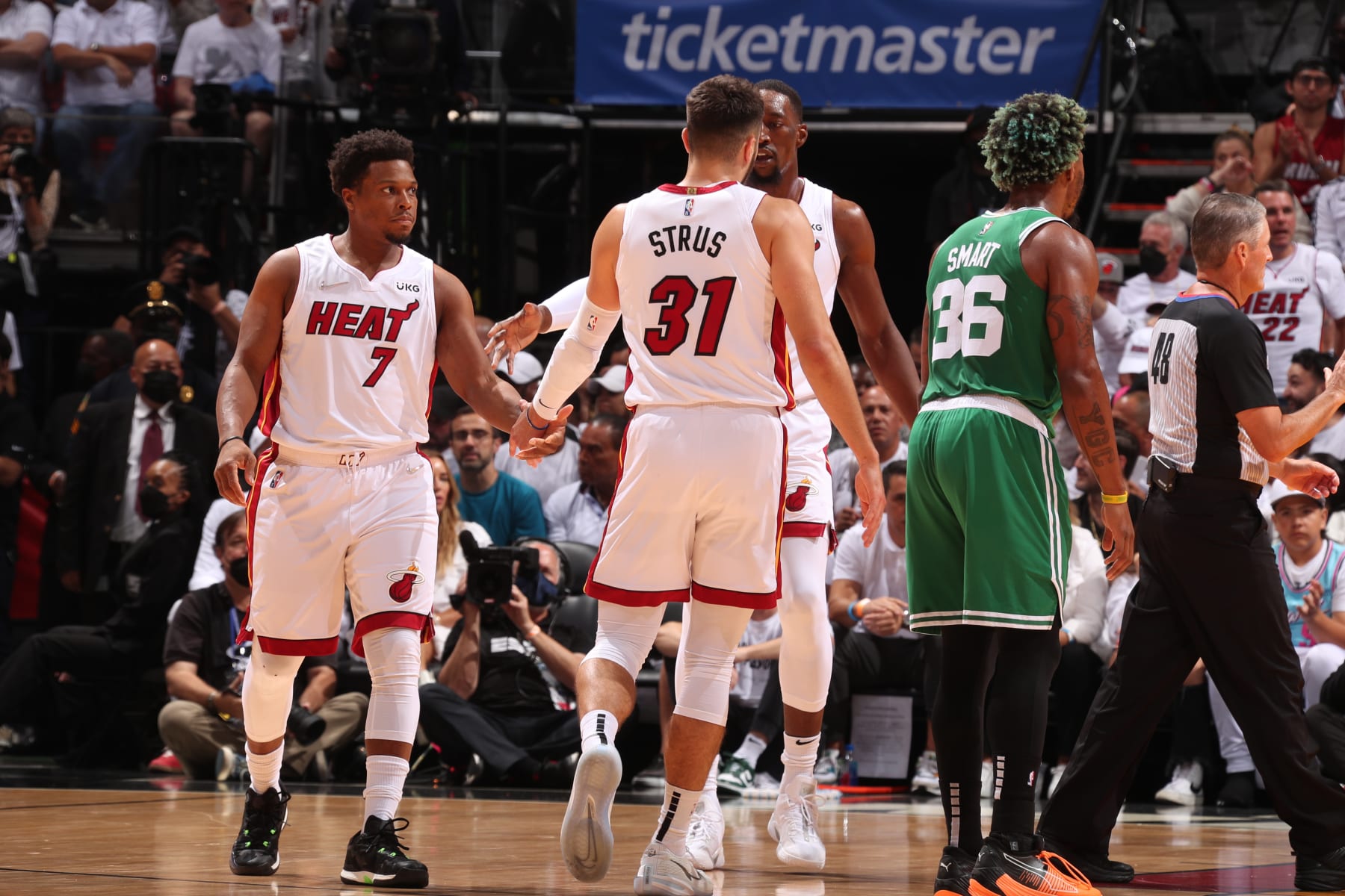 MIAMI, FL - MAY 29: Kyle Lowry #7 of the Miami Heat high fives Max Strus #31 of the Miami Heat during Game 7 of the 2022 NBA Playoffs Eastern Conference Finals on May 29, 2022 at FTX Arena in Miami, Florida. NOTE TO USER: User expressly acknowledges and agrees that, by downloading and or using this Photograph, user is consenting to the terms and conditions of the Getty Images License Agreement. Mandatory Copyright Notice: Copyright 2022 NBAE (Photo by Issac Baldizon/NBAE via Getty Images)