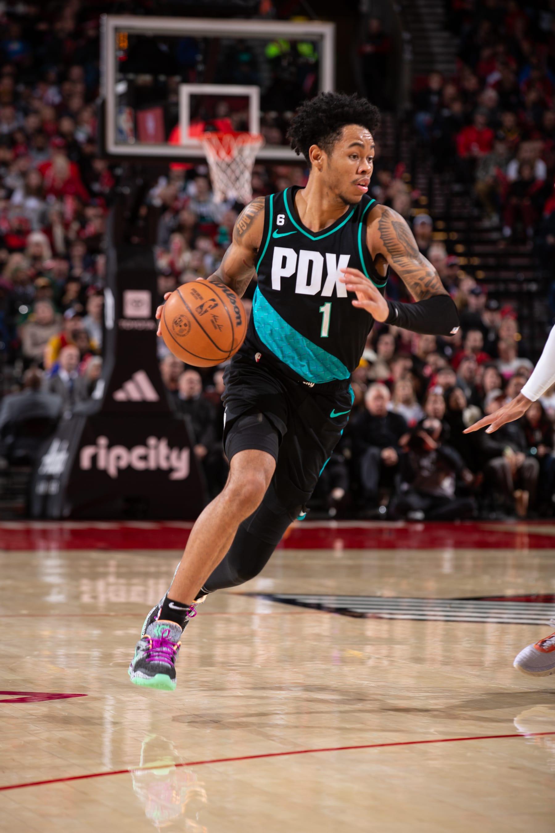 PORTLAND, OR - JANUARY 10:  Anfernee Simons #1 of the Portland Trail Blazers dribbles the ball during the game against the Orlando Magic on January 10, 2023 at the Moda Center Arena in Portland, Oregon. NOTE TO USER: User expressly acknowledges and agrees that, by downloading and or using this photograph, user is consenting to the terms and conditions of the Getty Images License Agreement. Mandatory Copyright Notice: Copyright 2023 NBAE (Photo by Cameron Browne/NBAE via Getty Images)
