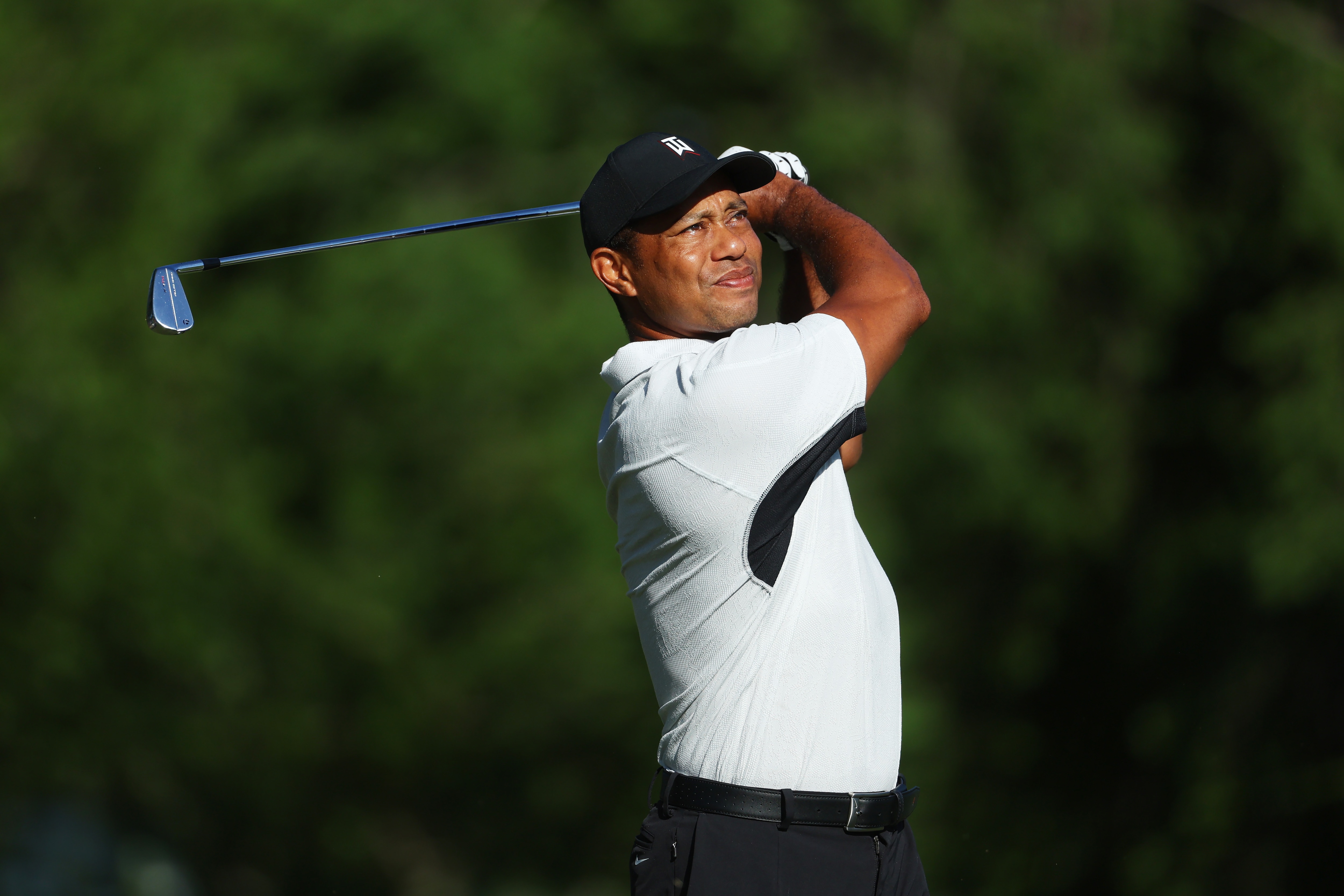 TULSA, OKLAHOMA - MAY 16: Tiger Woods of the United States plays a shot during a practice round prior to the start of the 2022 PGA Championship at Southern Hills Country Club on May 16, 2022 in Tulsa, Oklahoma. (Photo by Andrew Redington/Getty Images)