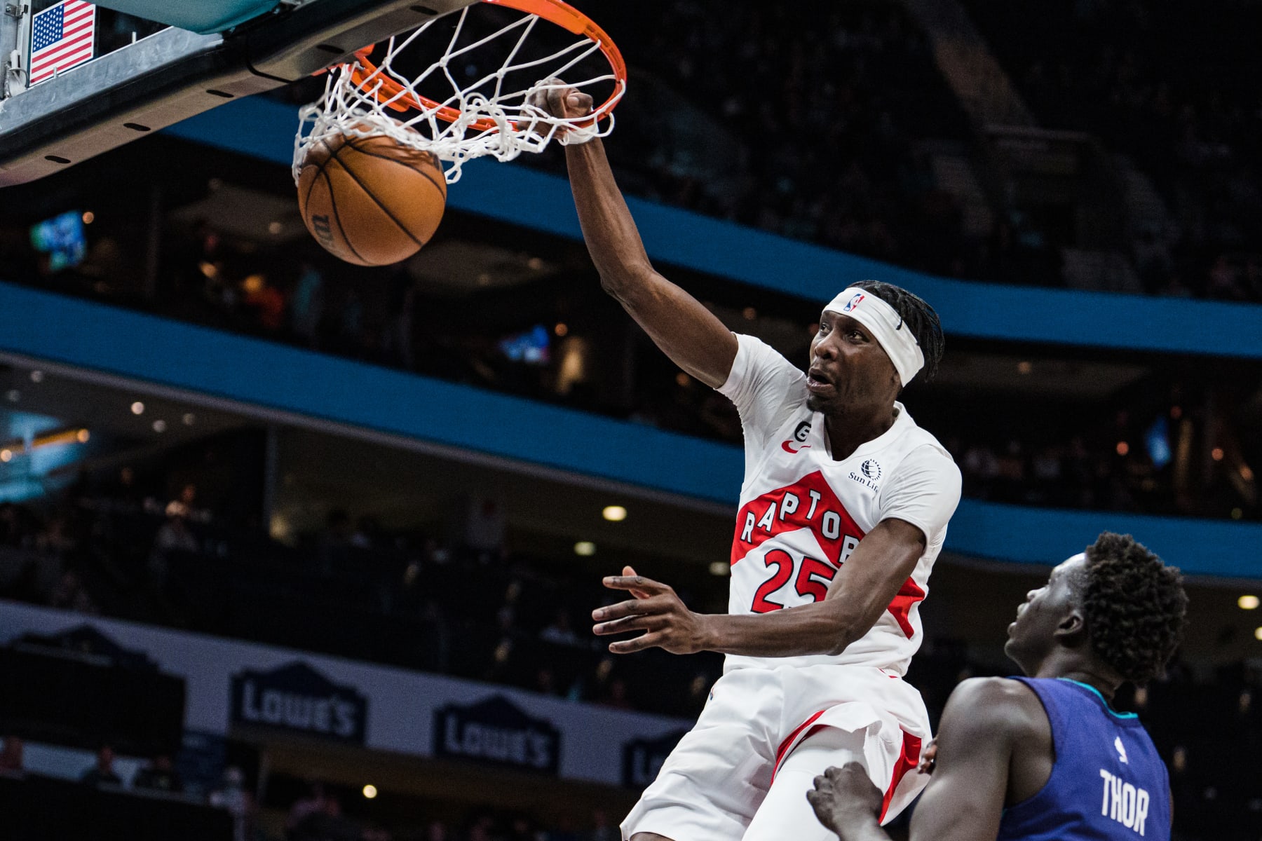 CHARLOTTE, NORTH CAROLINA - APRIL 02: Chris Boucher #25 of the Toronto Raptors dunks the ball against the Charlotte Hornets in the fourth quarter during their game at Spectrum Center on April 02, 2023 in Charlotte, North Carolina. NOTE TO USER: User expressly acknowledges and agrees that, by downloading and or using this photograph, User is consenting to the terms and conditions of the Getty Images License Agreement. (Photo by Jacob Kupferman/Getty Images)