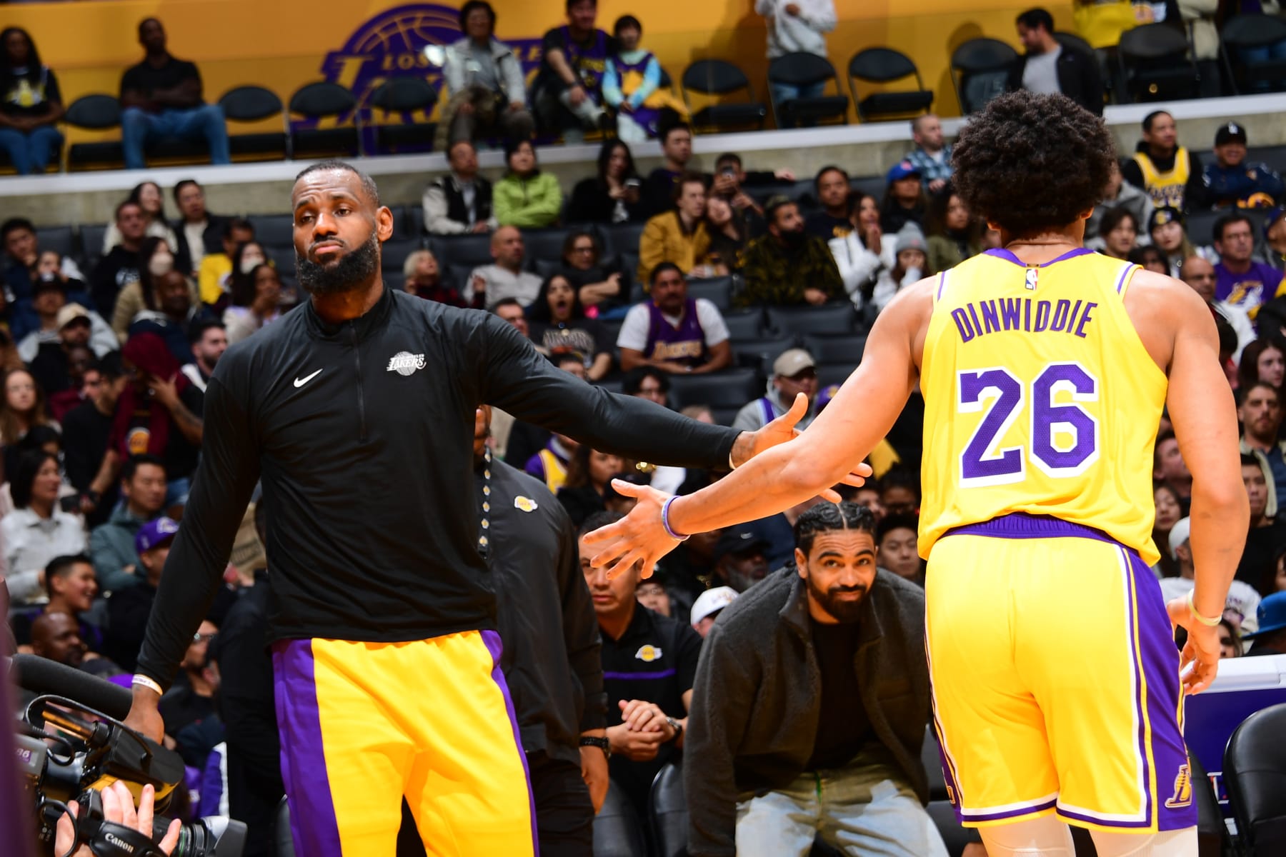 LOS ANGELES, CA - FEBRUARY 13: LeBron James #23 of the Los Angeles Lakers high fives Spencer Dinwiddie #26 of the Los Angeles Lakers during the game against the Detroit Pistons on February 13, 2024 at Crypto.Com Arena in Los Angeles, California. NOTE TO USER: User expressly acknowledges and agrees that, by downloading and/or using this Photograph, user is consenting to the terms and conditions of the Getty Images License Agreement. Mandatory Copyright Notice: Copyright 2024 NBAE (Photo by Adam Pantozzi/NBAE via Getty Images)
