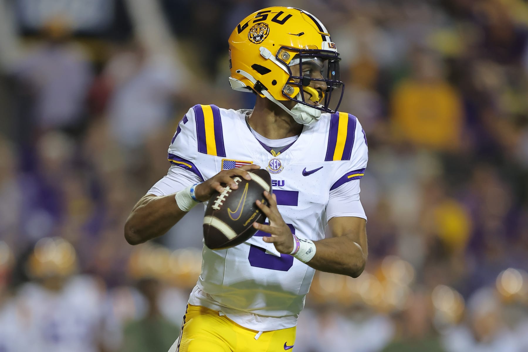 BATON ROUGE, LOUISIANA - NOVEMBER 11: Jayden Daniels #5 of the LSU Tigers throws the ball against the Florida Gators during a game at Tiger Stadium on November 11, 2023 in Baton Rouge, Louisiana. (Photo by Jonathan Bachman/Getty Images)