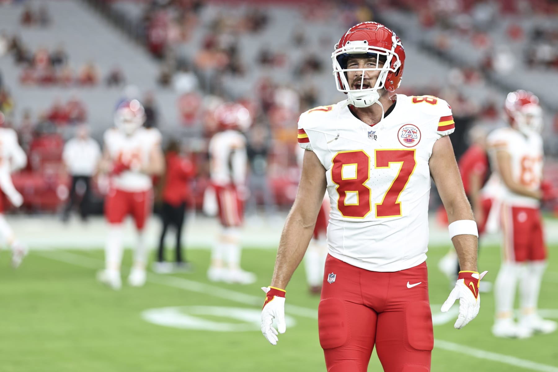 GLENDALE, ARIZONA - AUGUST 19: Travis Kelce #87 of the Kansas City Chiefs reacts as he warms up prior to an NFL preseason football game between the Arizona Cardinals and the Kansas City Chiefs at State Farm Stadium on August 19, 2023 in Glendale, Arizona. (Photo by Michael Owens/Getty Images)