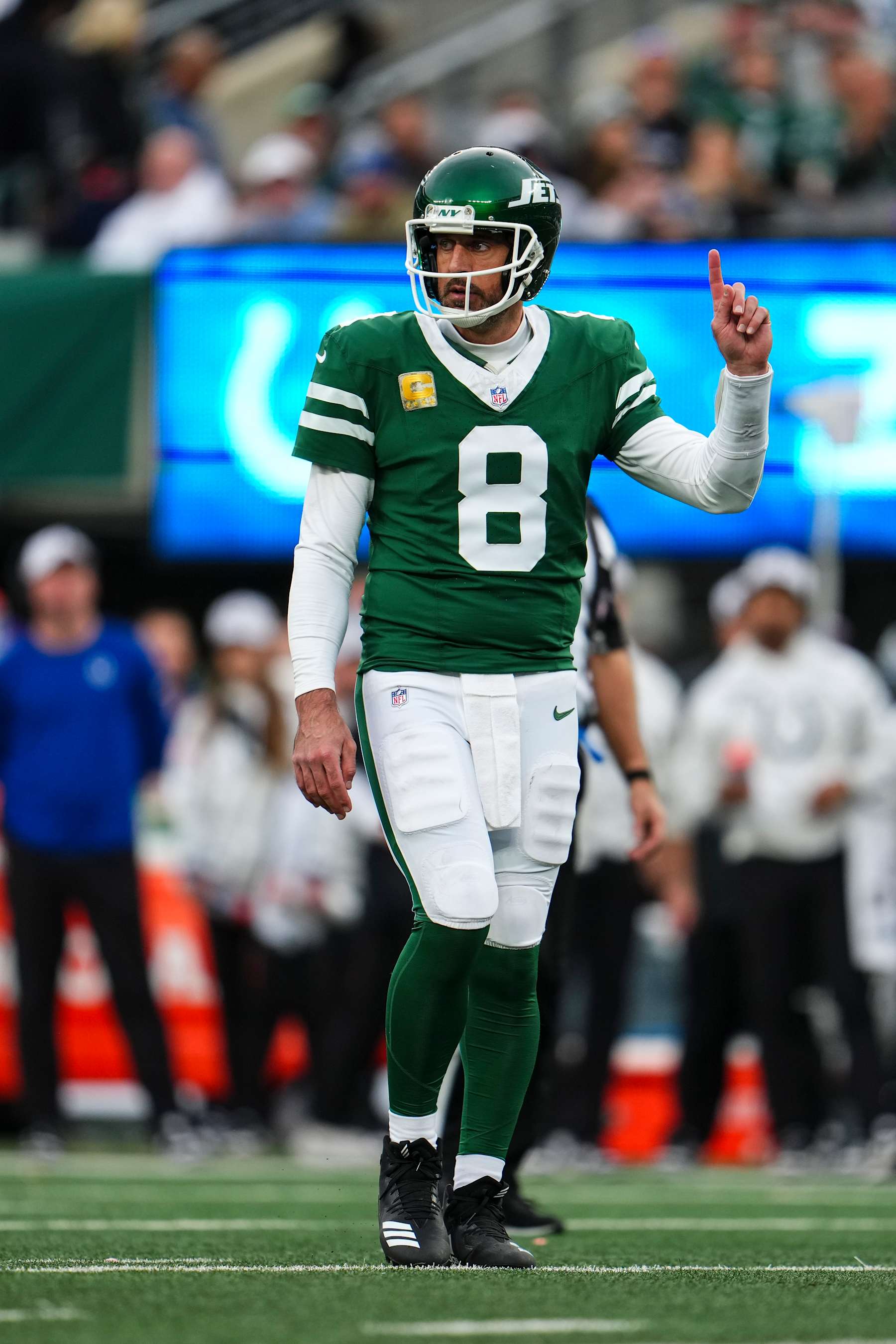 EAST RUTHERFORD, NJ - NOVEMBER 17: Aaron Rodgers #8 of the New York Jets looks on from the field during an NFL football game against the Indianapolis Colts at MetLife Stadium on November 17, 2024 in East Rutherford, New Jersey. (Photo by Cooper Neill/Getty Images)