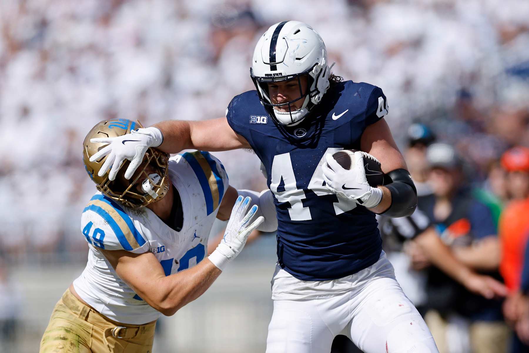 UNIVERSITY PARK, PA - OCTOBER 05: Penn State Nittany Lions tight end Tyler Warren (44) runs with the ball after a reception while being pursued by UCLA Bruins linebacker Carson Schwesinger (49) during a college football game on October 5, 2024 at Beaver Stadium in University Park, Pennsylvania. (Photo by Joe Robbins/Icon Sportswire via Getty Images)