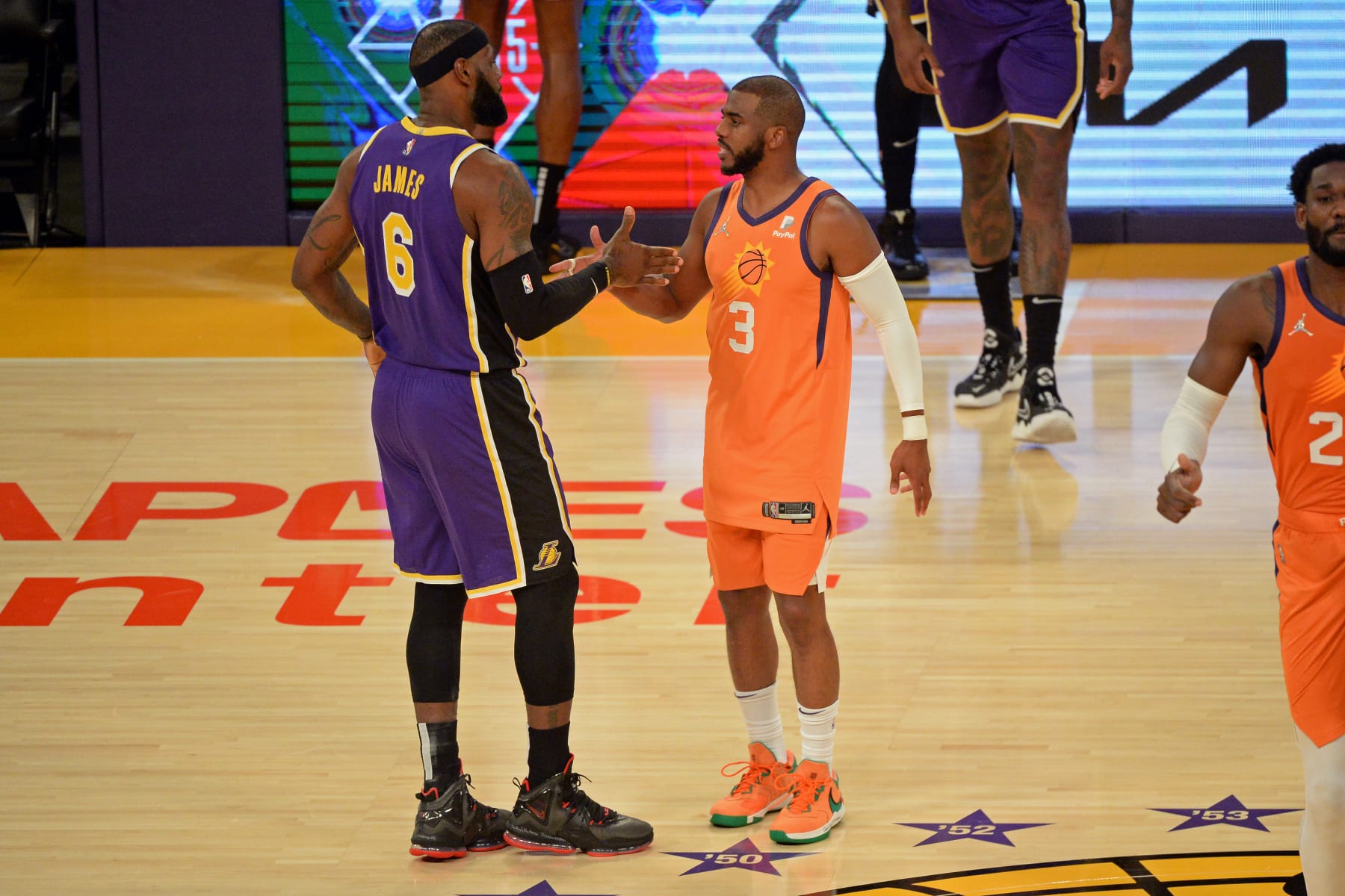 LOS ANGELES, CA - OCTOBER 22: LeBron James #6 of the Los Angeles Lakers and Chris Paul #3 of the Phoenix Suns shake hands before the game on October 22, 2021 at STAPLES Center in Los Angeles, California. NOTE TO USER: User expressly acknowledges and agrees that, by downloading and/or using this Photograph, user is consenting to the terms and conditions of the Getty Images License Agreement. Mandatory Copyright Notice: Copyright 2021 NBAE (Photo by Ned Dishman/NBAE via Getty Images)