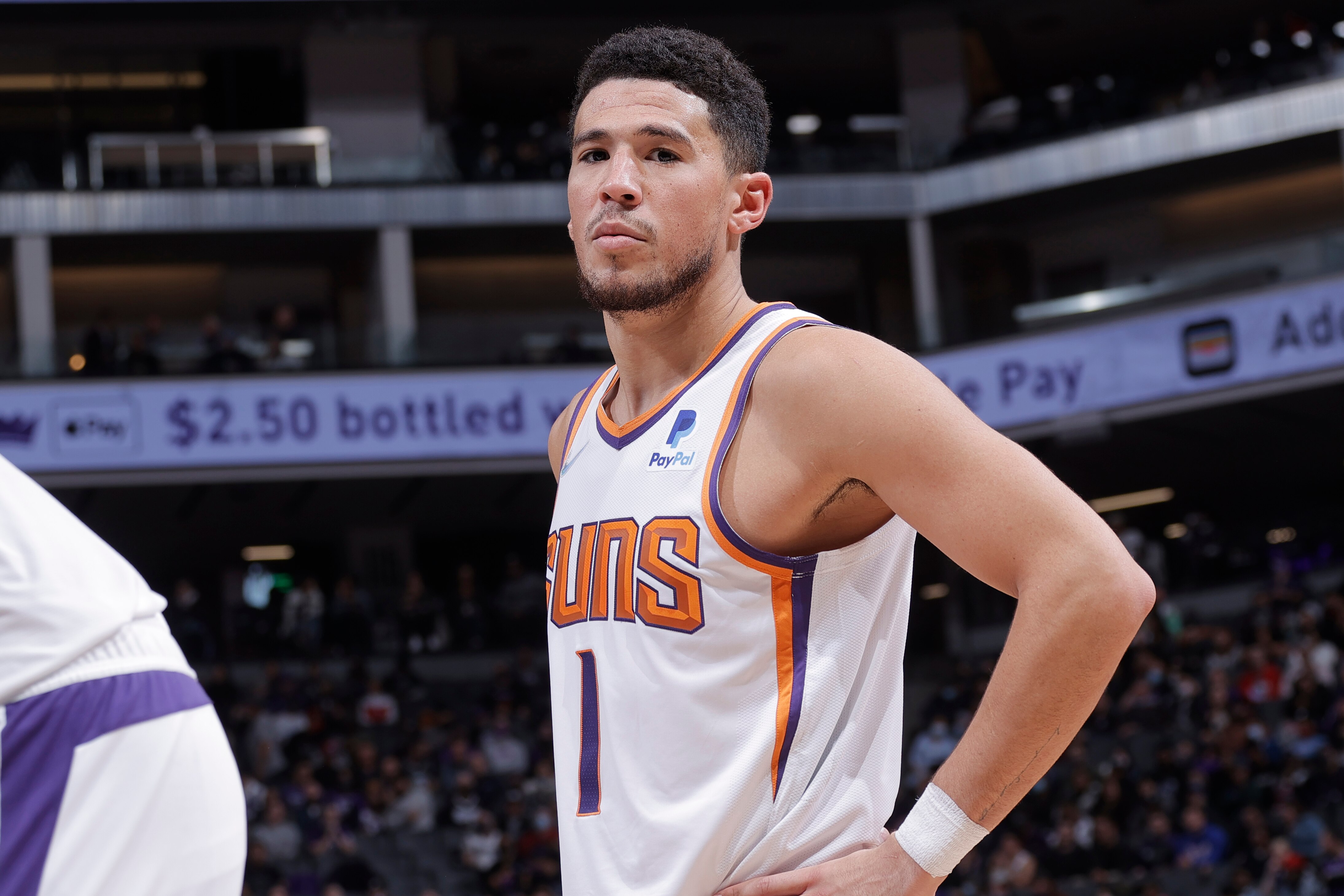 SACRAMENTO, CA - NOVEMBER 8: Devin Booker #1 of the Phoenix Suns looks on during the game against the Sacramento Kings on November 8, 2021 at Golden 1 Center in Sacramento, California. NOTE TO USER: User expressly acknowledges and agrees that, by downloading and or using this Photograph, user is consenting to the terms and conditions of the Getty Images License Agreement. Mandatory Copyright Notice: Copyright 2021 NBAE (Photo by Rocky Widner/NBAE via Getty Images)