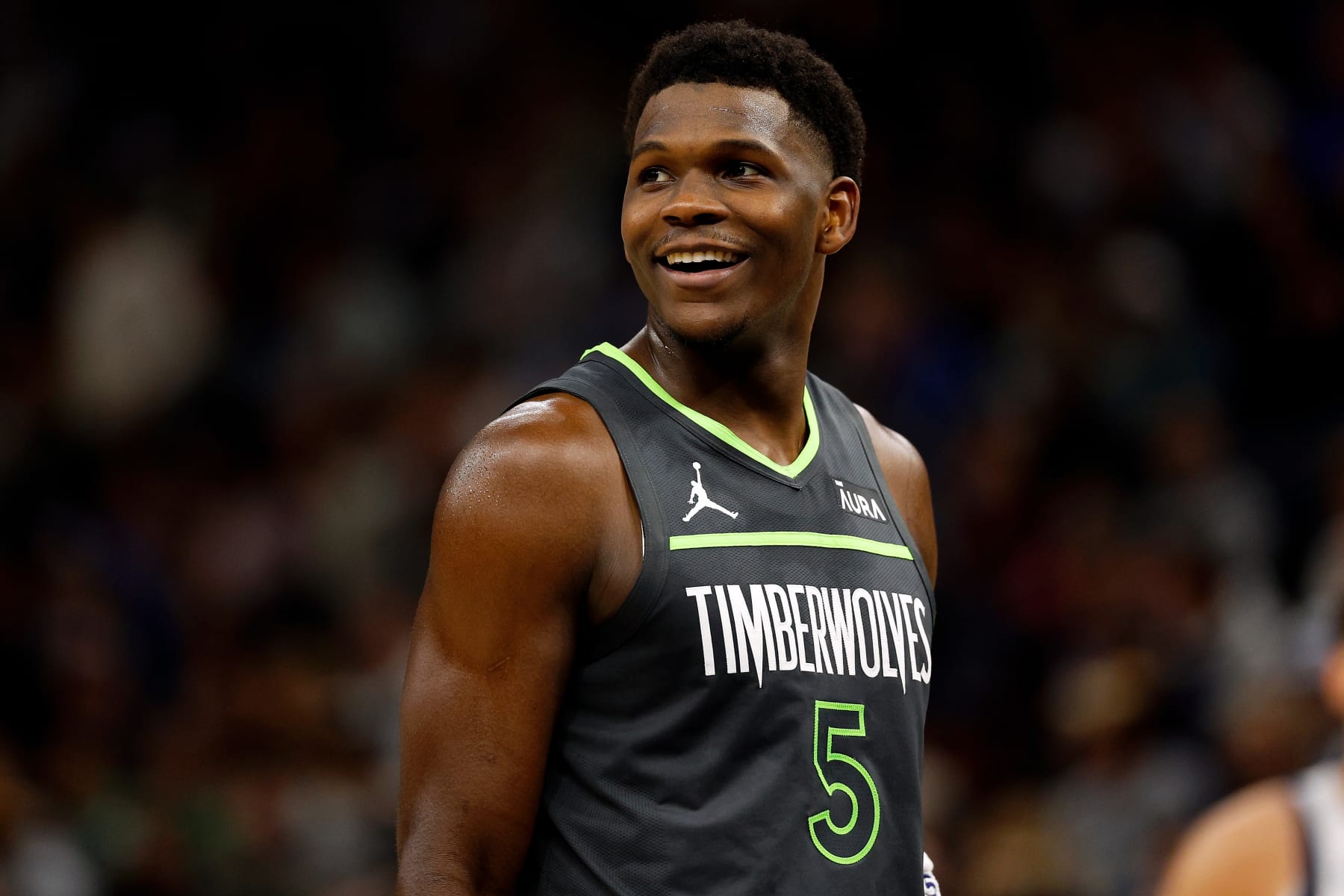 MINNEAPOLIS, MINNESOTA - DECEMBER 28: Anthony Edwards #5 of the Minnesota Timberwolves smiles in the second quarter against the Dallas Mavericks at Target Center on December 28, 2023 in Minneapolis, Minnesota. The Timberwolves defeated the Mavericks 118-110. NOTE TO USER: User expressly acknowledges and agrees that, by downloading and or using this photograph, User is consenting to the terms and conditions of the Getty Images License Agreement. (Photo by David Berding/Getty Images)