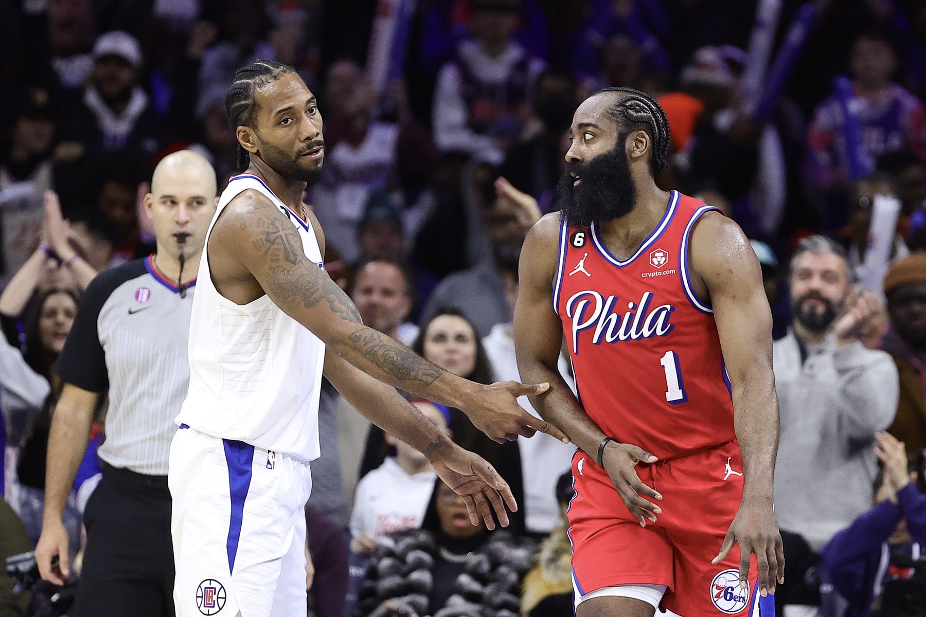 PHILADELPHIA, PENNSYLVANIA - DECEMBER 23: Kawhi Leonard #2 of the LA Clippers and James Harden #1 of the Philadelphia 76ers speak during the fourth quarter  at Wells Fargo Center on December 23, 2022 in Philadelphia, Pennsylvania. NOTE TO USER: User expressly acknowledges and agrees that, by downloading and or using this photograph, User is consenting to the terms and conditions of the Getty Images License Agreement. (Photo by Tim Nwachukwu/Getty Images)