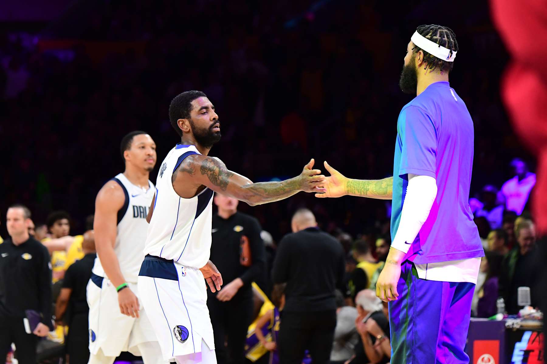 LOS ANGELES, CA - NOVEMBER 22: Kyrie Irving #11 of the Dallas Mavericks high fives Anthony Davis #3 of the Los Angeles Lakers during the game on November 22, 2023 at Crypto.Com Arena in Los Angeles, California. NOTE TO USER: User expressly acknowledges and agrees that, by downloading and/or using this Photograph, user is consenting to the terms and conditions of the Getty Images License Agreement. Mandatory Copyright Notice: Copyright 2023 NBAE (Photo by Adam Pantozzi/NBAE via Getty Images)