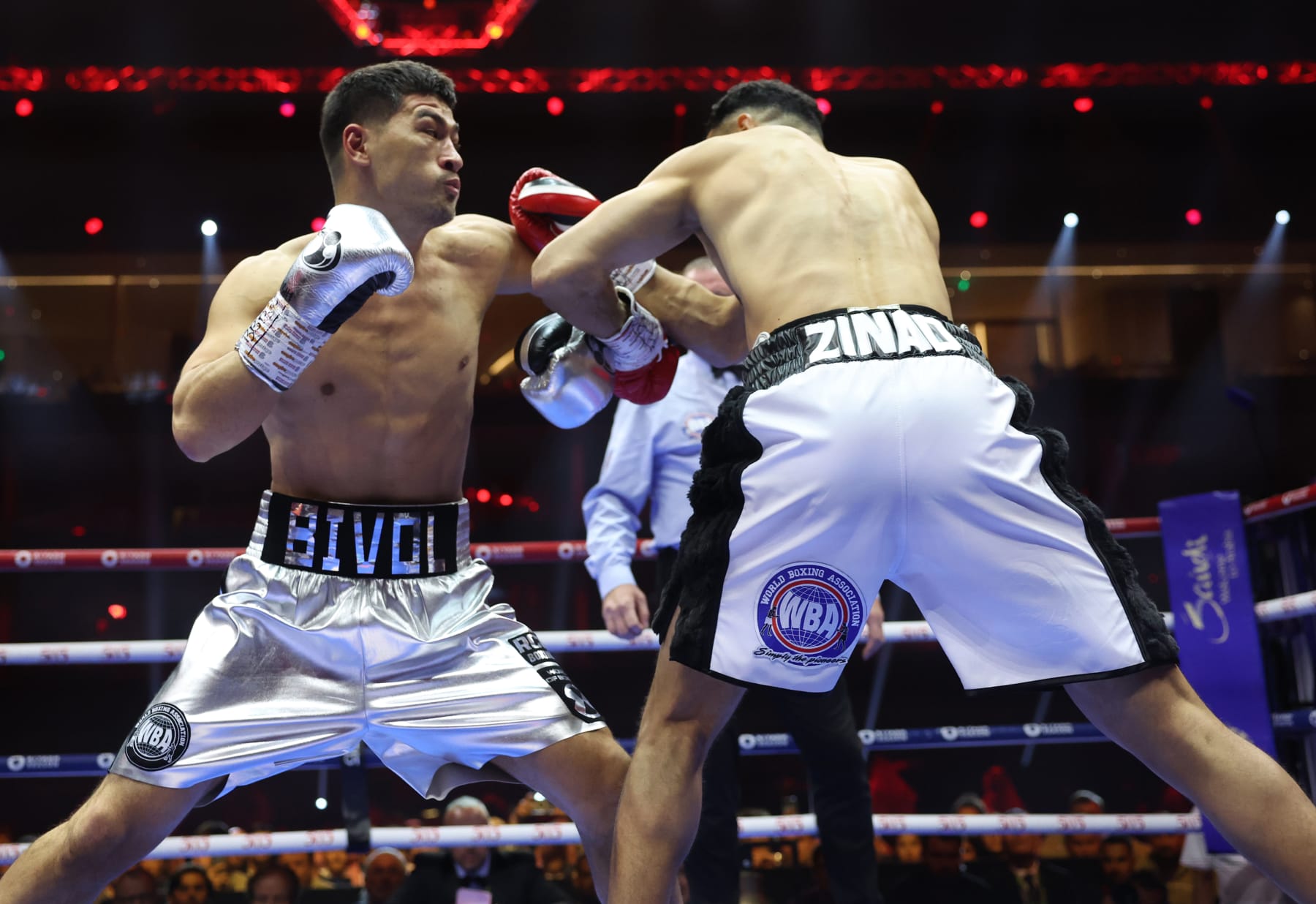 RIYADH, SAUDI ARABIA - JUNE 1: Dmitry Bivol (silver shorts) and Malik Zinad (white and black shorts) exchange punches during their WBA and IBO Light Heavyweight World Title contest on June 1, 2024 in Riyadh, Saudi Arabia. (Photo by Mark Robinson/Matchroom Boxing/Getty Images)
