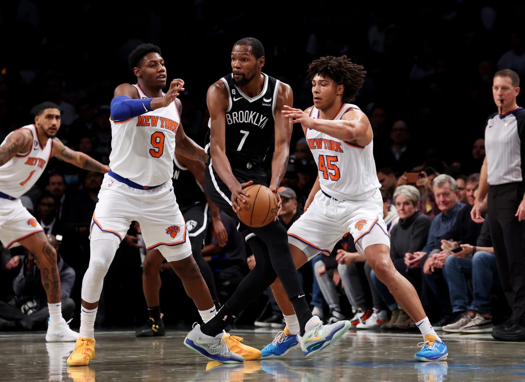NEW YORK, NEW YORK - NOVEMBER 09:  Kevin Durant #7 of the Brooklyn Nets looks to pass against RJ Barrett #9 and Jericho Sims #45 of the New York Knicks during their game at Barclays Center on November 09, 2022 in New York City.  User expressly acknowledges and agrees that, by downloading and or using this photograph, User is consenting to the terms and conditions of the Getty Images License Agreement.  (Photo by Al Bello/Getty Images)