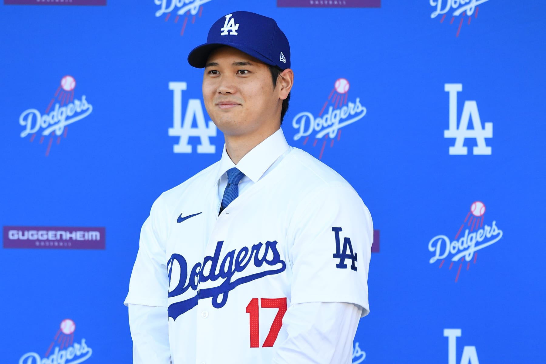 LOS ANGELES, CA - DECEMBER 14: Newly acquired Los Angeles Dodgers designated hitter Shohei Ohtani looks on as he is introduced at a press conference on December 14, 2023 at Dodger Stadium in Los Angeles, CA. (Photo by Brian Rothmuller/Icon Sportswire via Getty Images)