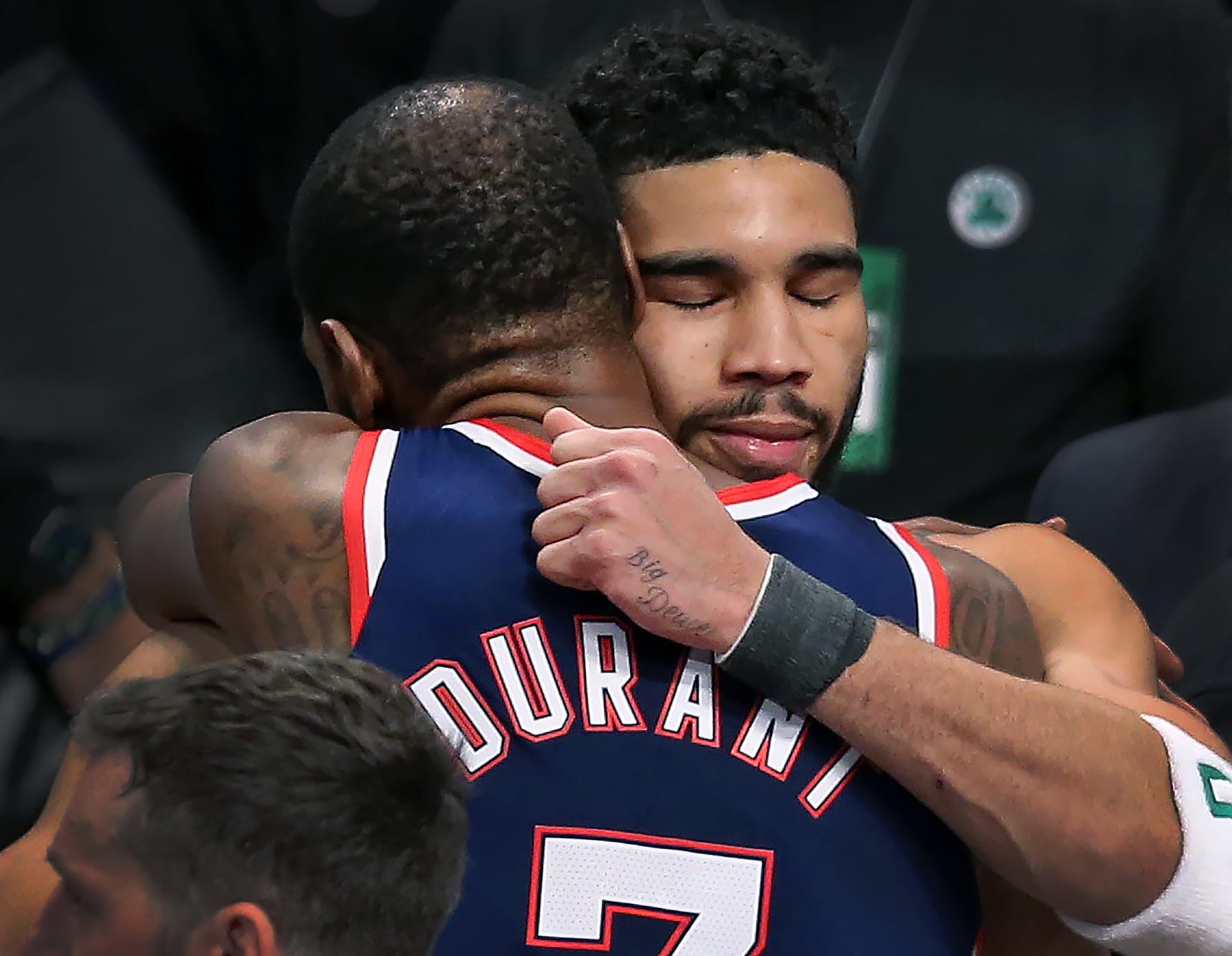 Brooklyn - April 25: The Celtics Jayson Tatum and the Nets Kevin Durant shared a lengthy hug following the Boston victory. The Boston Celtics visited the Brooklyn Nets for Game Four of their first round NBA playoff series at Barclays Center in Brooklyn, NY on April 25, 2022. (Photo by Jim Davis/The Boston Globe via Getty Images)