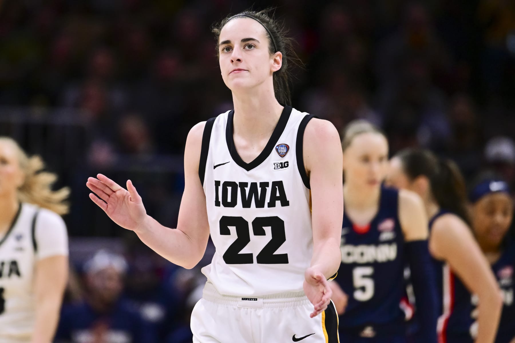 CLEVELAND, OHIO - APRIL 5: Caitlin Clark #22 of the Iowa Hawkeyes reacts against the UConn Huskies during the NCAA Women's Basketball Tournament Final Four semifinal game at Rocket Mortgage Fieldhouse on April 5, 2024 in Cleveland, Ohio. (Photo by Ben Solomon/NCAA Photos via Getty Images)