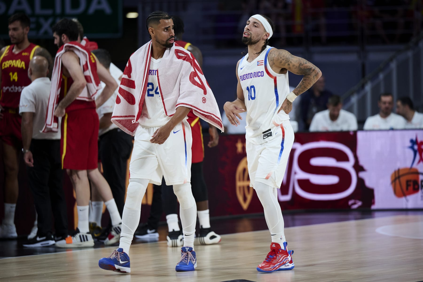 MADRID, SPAIN - JULY 23: Gian Clavell #24 and José Alvarado #10 of Puerto Rico talking during friendly match between Spain and Puerto Rico to preparation for Paris Olympic Games at WiZink Center on July 23, 2024 in Madrid, Spain. (Photo by Borja B. Hojas/Getty Images)