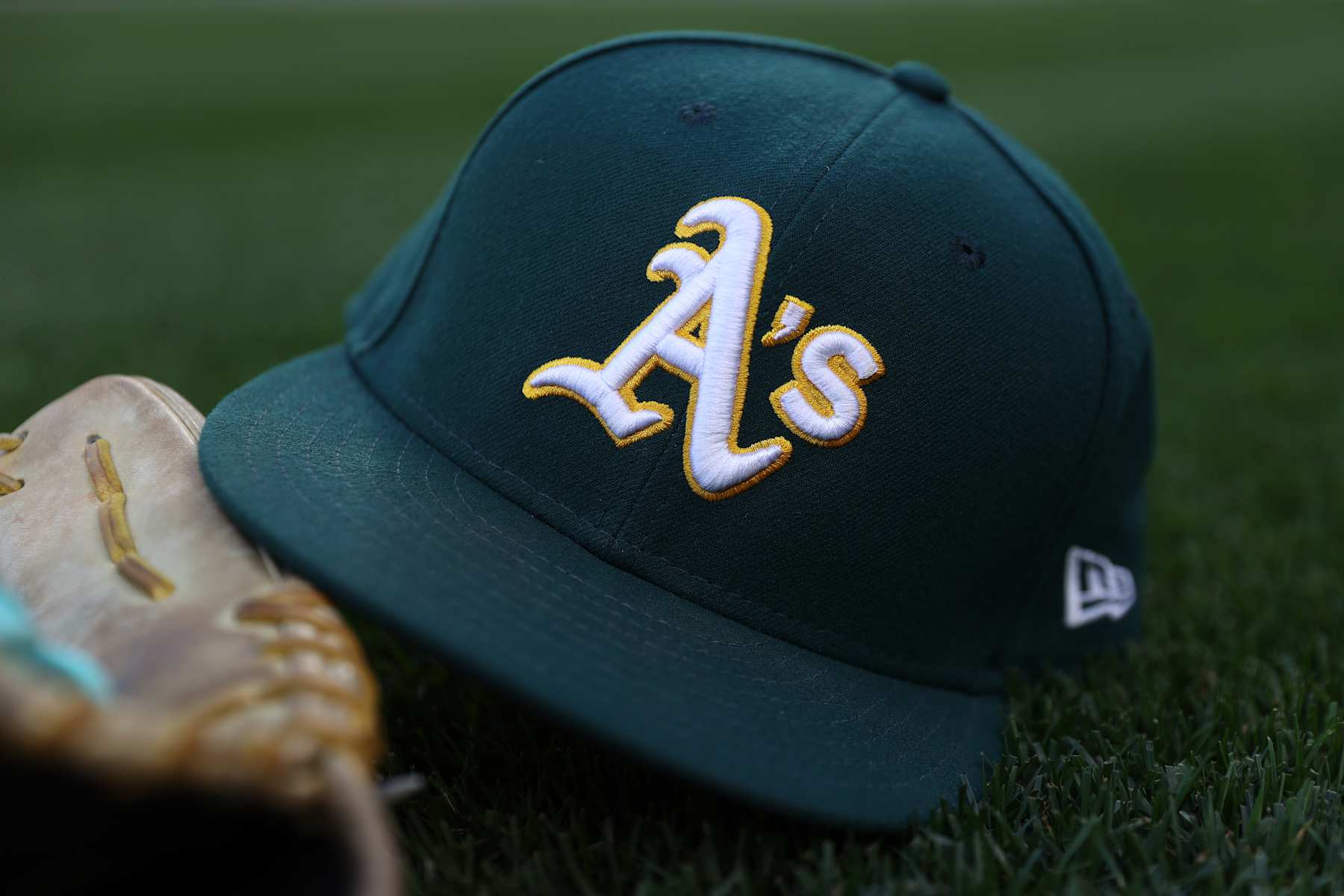 SEATTLE, WASHINGTON - SEPTEMBER 27: A general view of an Oakland Athletics logo and hat before the game against the Seattle Mariners at T-Mobile Park on September 27, 2024 in Seattle, Washington. (Photo by Steph Chambers/Getty Images)