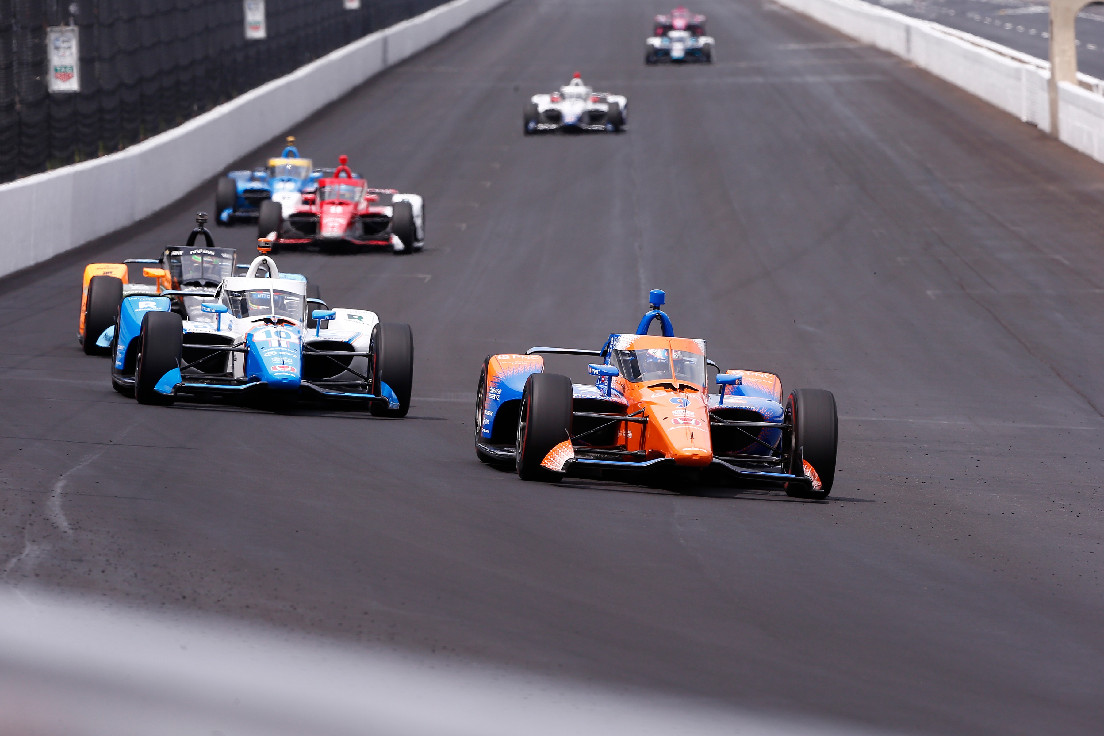 INDIANAPOLIS, IN - MAY 19: Scott Dixon (9) Chip Ganassi Racing Honda and his Ganassi teammates head into turn one during the practice session for the NTT IndyCar Series Indianapolis 500 on May 19, 2022, at the Indianapolis Motor Speedway in Indianapolis, Indiana.(Photo by Jeffrey Brown/Icon Sportswire via Getty Images)