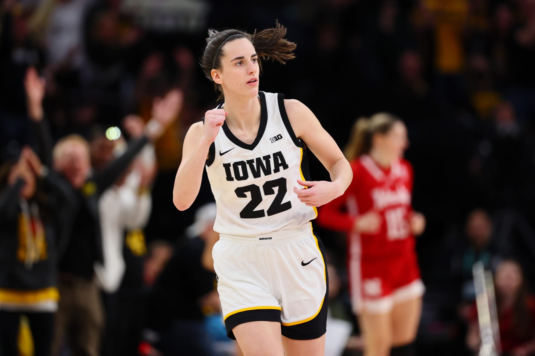 MINNEAPOLIS, MINNESOTA - MARCH 10: Caitlin Clark #22 of the Iowa Hawkeyes reacts after a three point basket in the first half against the Nebraska Cornhuskers during the Big Ten Women's Basketball Tournament Championship at Target Center on March 10, 2024 in Minneapolis, Minnesota. (Photo by Adam Bettcher/Getty Images)