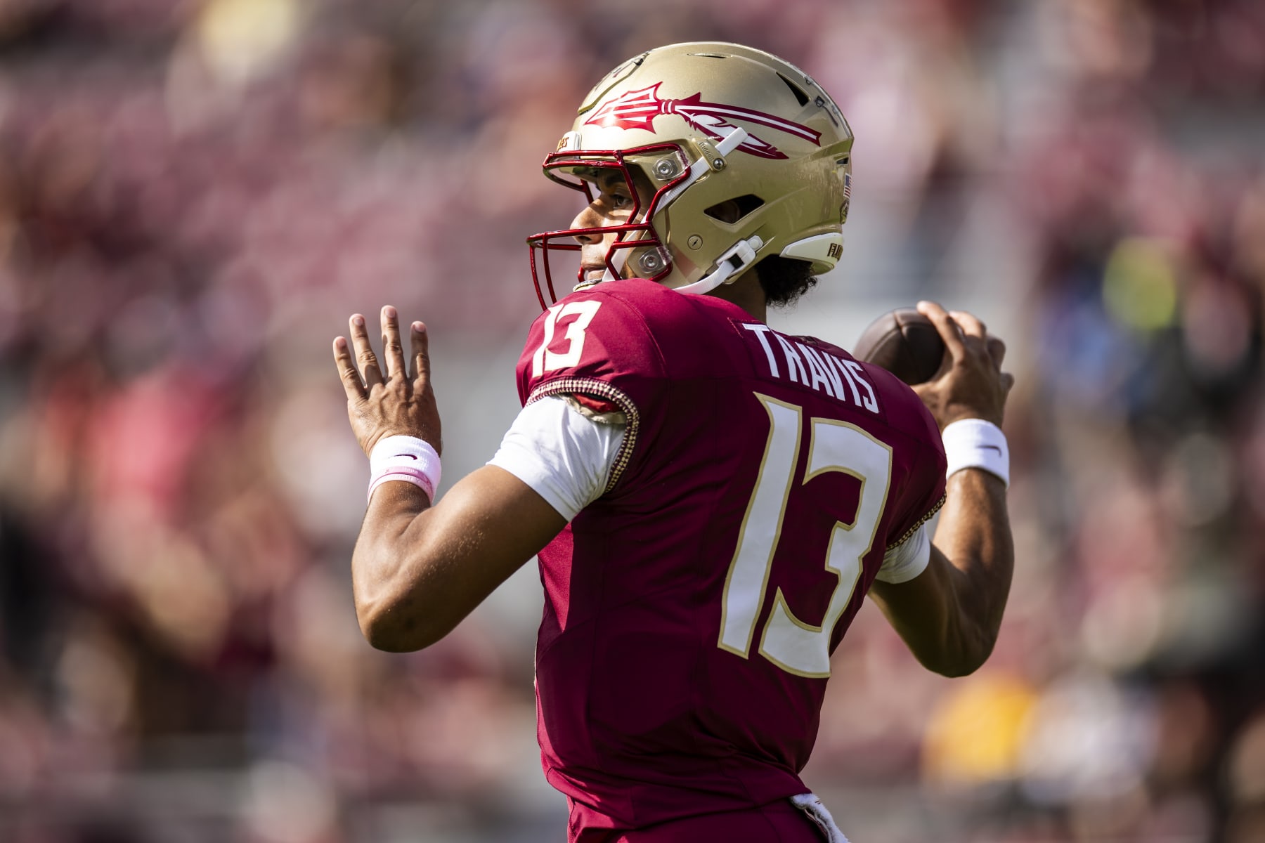 TALLAHASSEE, FLORIDA - OCTOBER 14: Jordan Travis #13 of the Florida State Seminoles warms up before the start of a game against the Syracuse Orange at Doak Campbell Stadium on October 14, 2023 in Tallahassee, Florida. (Photo by James Gilbert/Getty Images)