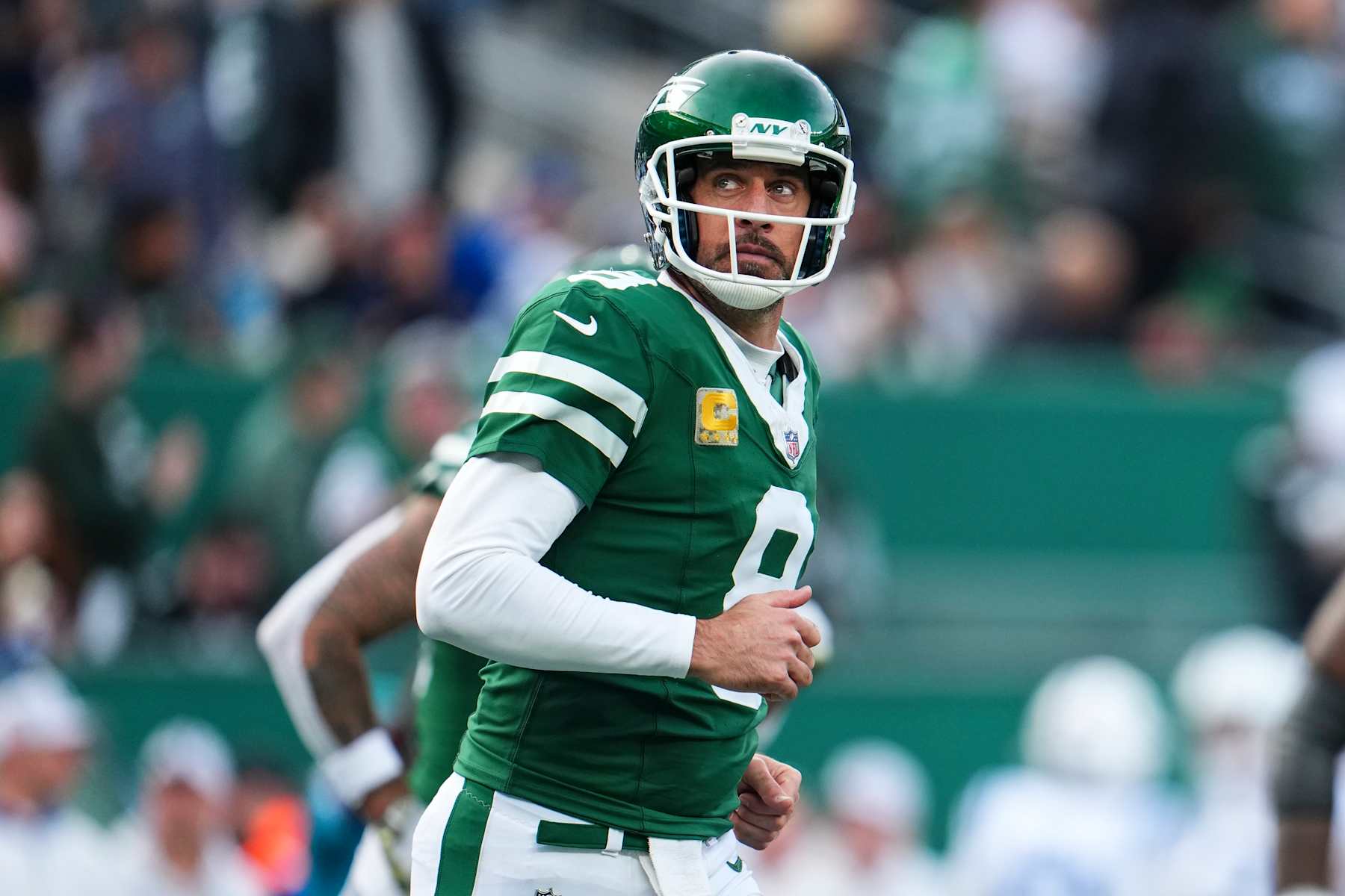 EAST RUTHERFORD, NJ - NOVEMBER 17: Aaron Rodgers #8 of the New York Jets looks on from the field during an NFL football game against the Indianapolis Colts at MetLife Stadium on November 17, 2024 in East Rutherford, New Jersey. (Photo by Cooper Neill/Getty Images)