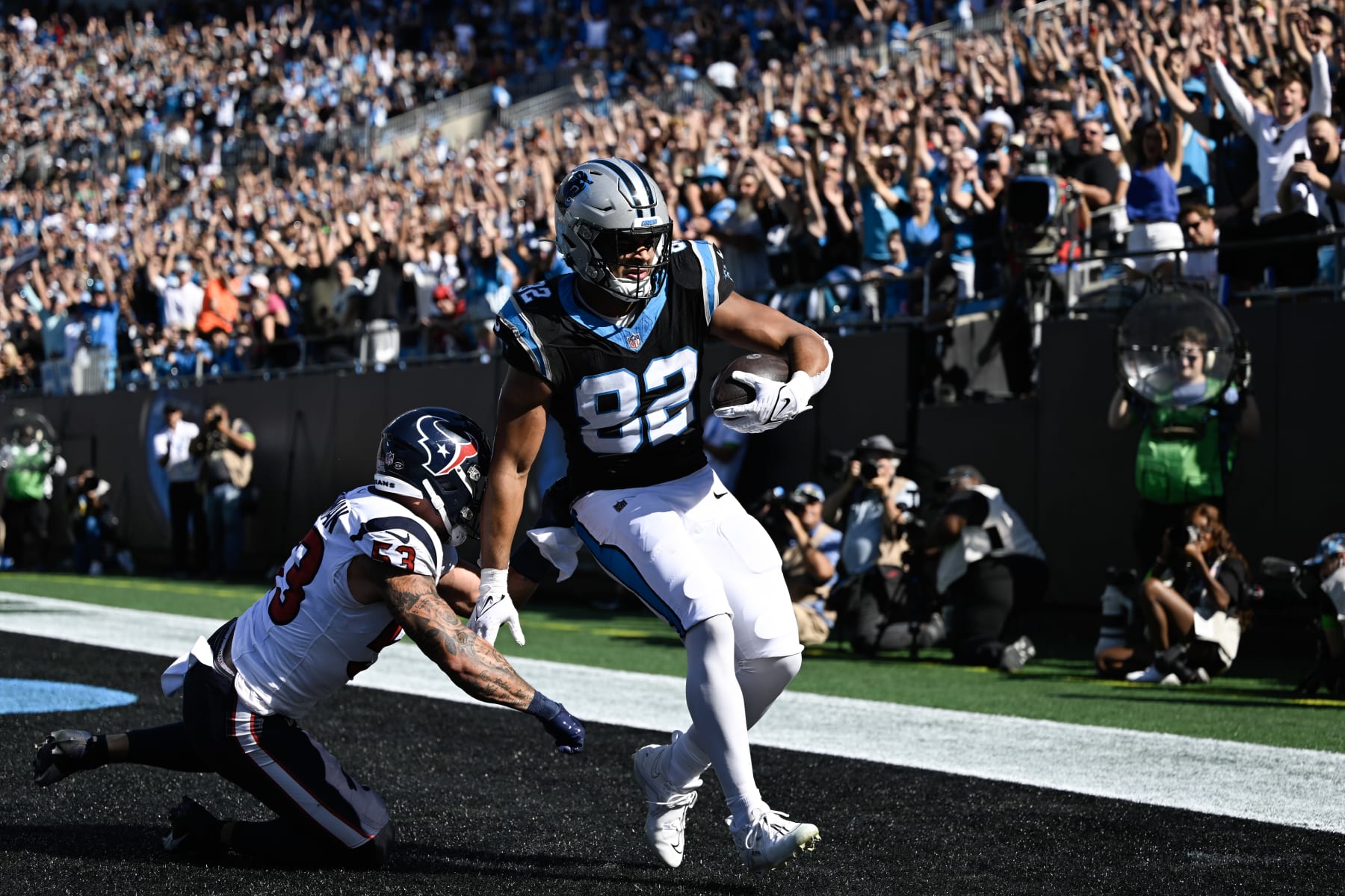 CHARLOTTE, NORTH CAROLINA - OCTOBER 29: Tommy Tremble #82 of the Carolina Panthers scores a touchdown during the second quarter of the game against the Houston Texans at Bank of America Stadium on October 29, 2023 in Charlotte, North Carolina. (Photo by Eakin Howard/Getty Images)