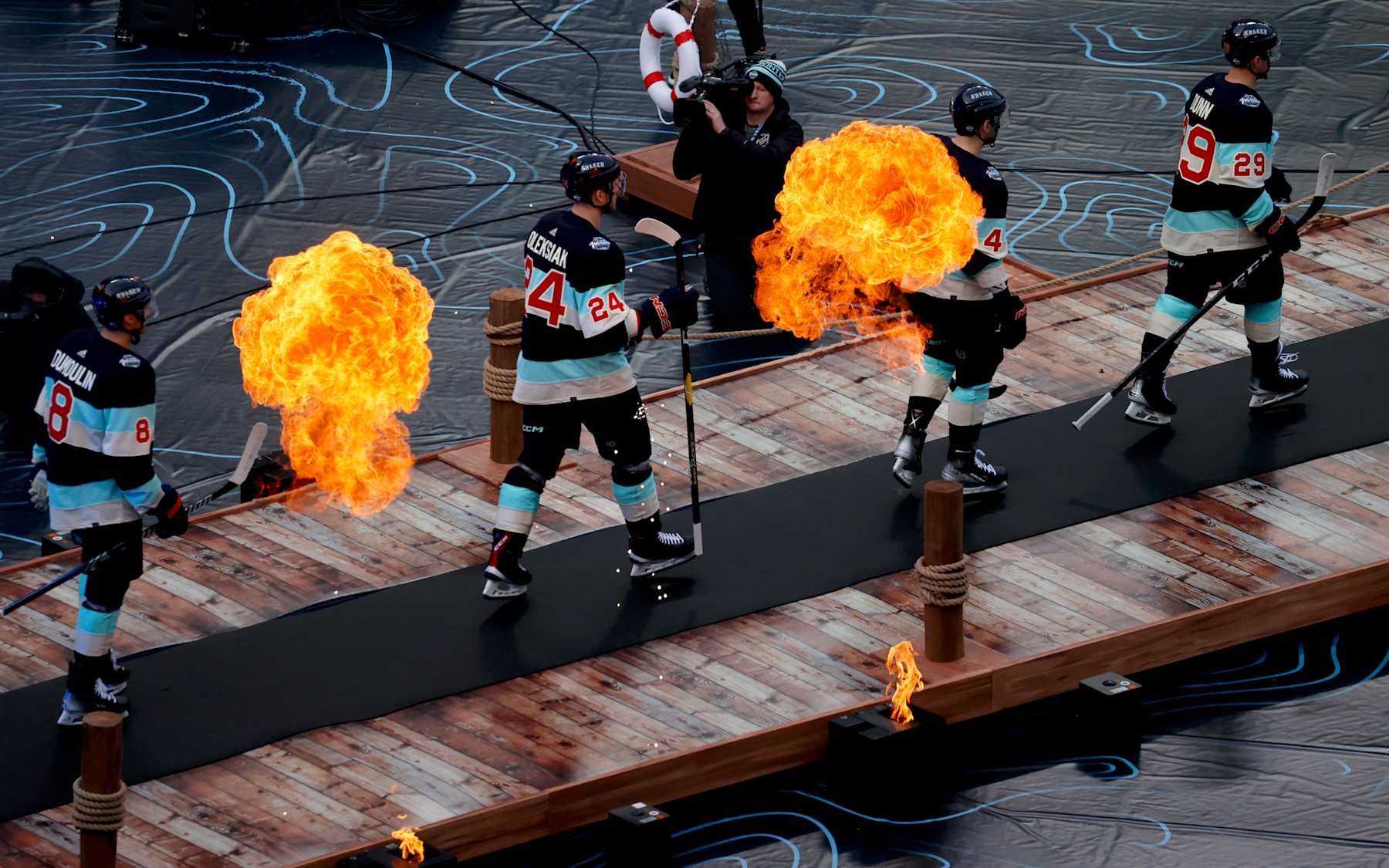 SEATTLE, WASHINGTON - JANUARY 01: (L-R) Brian Dumoulin #8, Jamie Oleksiak #24, Justin Schultz #4 and Vince Dunn #29 of the Seattle Kraken make their way to the ice surface for the 2024 Discover NHL Winter Classic between the Vegas Golden Knights and the Seattle Kraken at T-Mobile Park on January 01, 2024 in Seattle, Washington. (Photo by Eliot J. Schechter/NHLI via Getty Images)