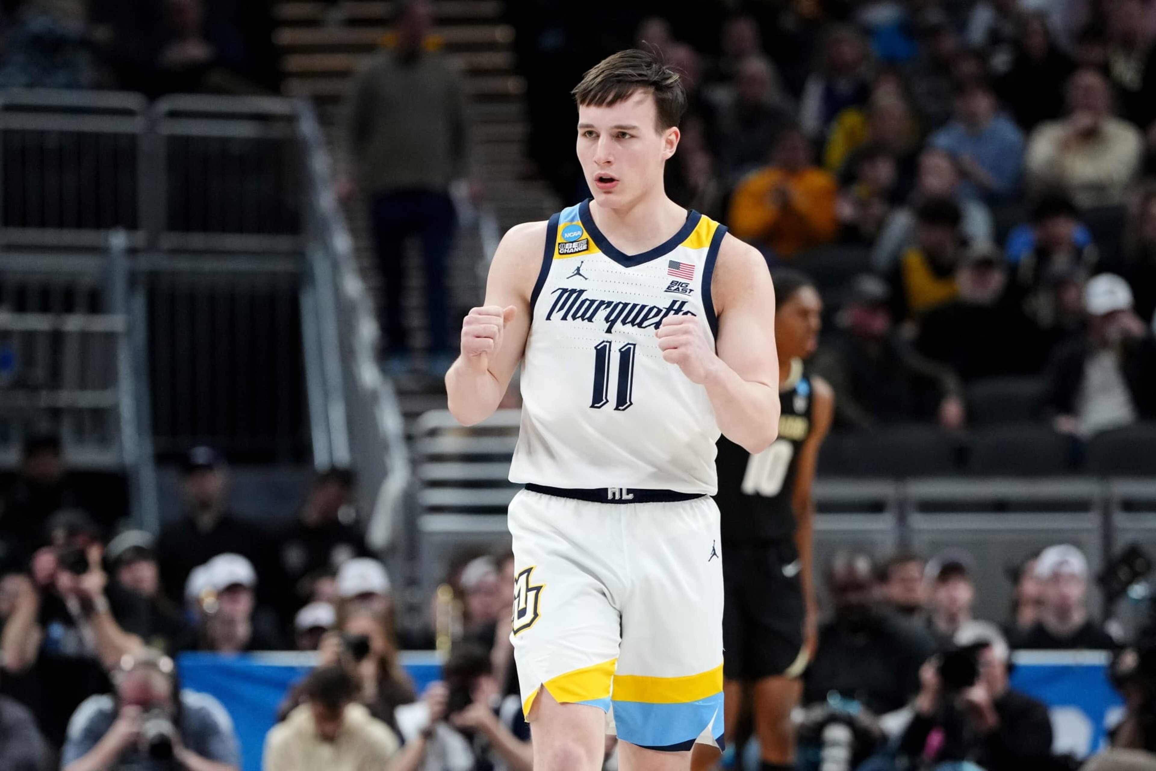 INDIANAPOLIS, INDIANA - MARCH 24: Tyler Kolek #11 of the Marquette Golden Eagles celebrates a basket against the Colorado Buffaloes during the first half in the second round of the NCAA Men's Basketball Tournament at Gainbridge Fieldhouse on March 24, 2024 in Indianapolis, Indiana. (Photo by Dylan Buell/Getty Images)