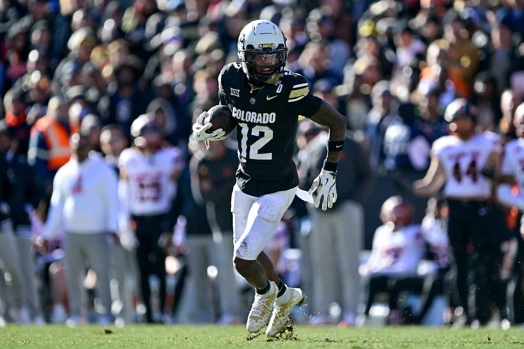 BOULDER, CO - NOVEMBER 29:  Travis Hunter #12 of the Colorado Buffaloes runs after a catch in the third quarter against the Oklahoma State Cowboys at Folsom Field on November 29, 2024 in Boulder, Colorado. (Photo by Dustin Bradford/Getty Images)