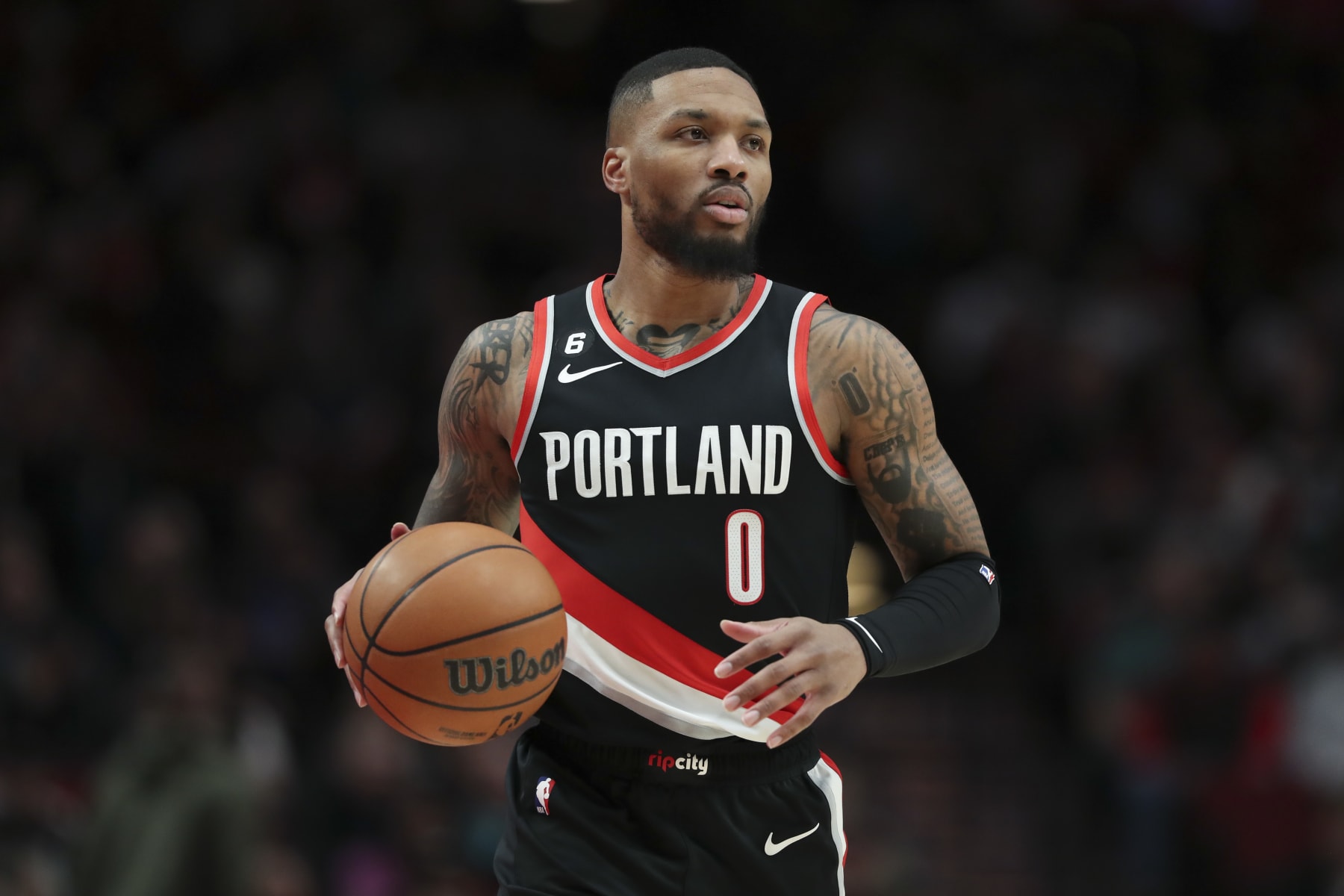 PORTLAND, OREGON - JANUARY 15: Damian Lillard #0 of the Portland Trail Blazers brings the ball up the court during the first quarter of a game against the Dallas Mavericks at Moda Center on January 15, 2023 in Portland, Oregon. NOTE TO USER: User expressly acknowledges and agrees that, by downloading and or using this photograph, user is consenting to the terms and conditions of the Getty Images License Agreement. (Photo by Amanda Loman/Getty Images)