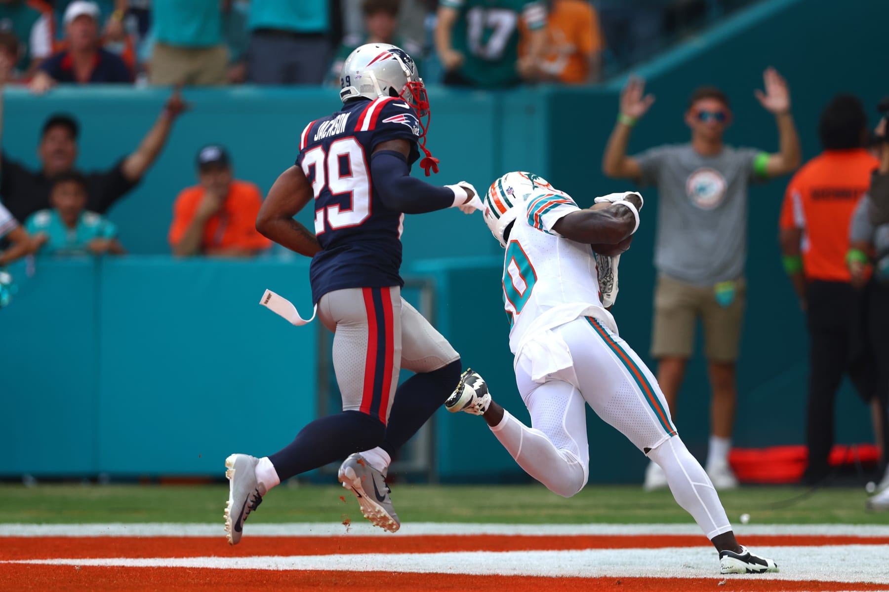 MIAMI GARDENS, FLORIDA - OCTOBER 29: Tyreek Hill #10 of the Miami Dolphins catches a touchdown over J.C. Jackson #29 of the New England Patriots during the first quarter at Hard Rock Stadium on October 29, 2023 in Miami Gardens, Florida. (Photo by Megan Briggs/Getty Images)